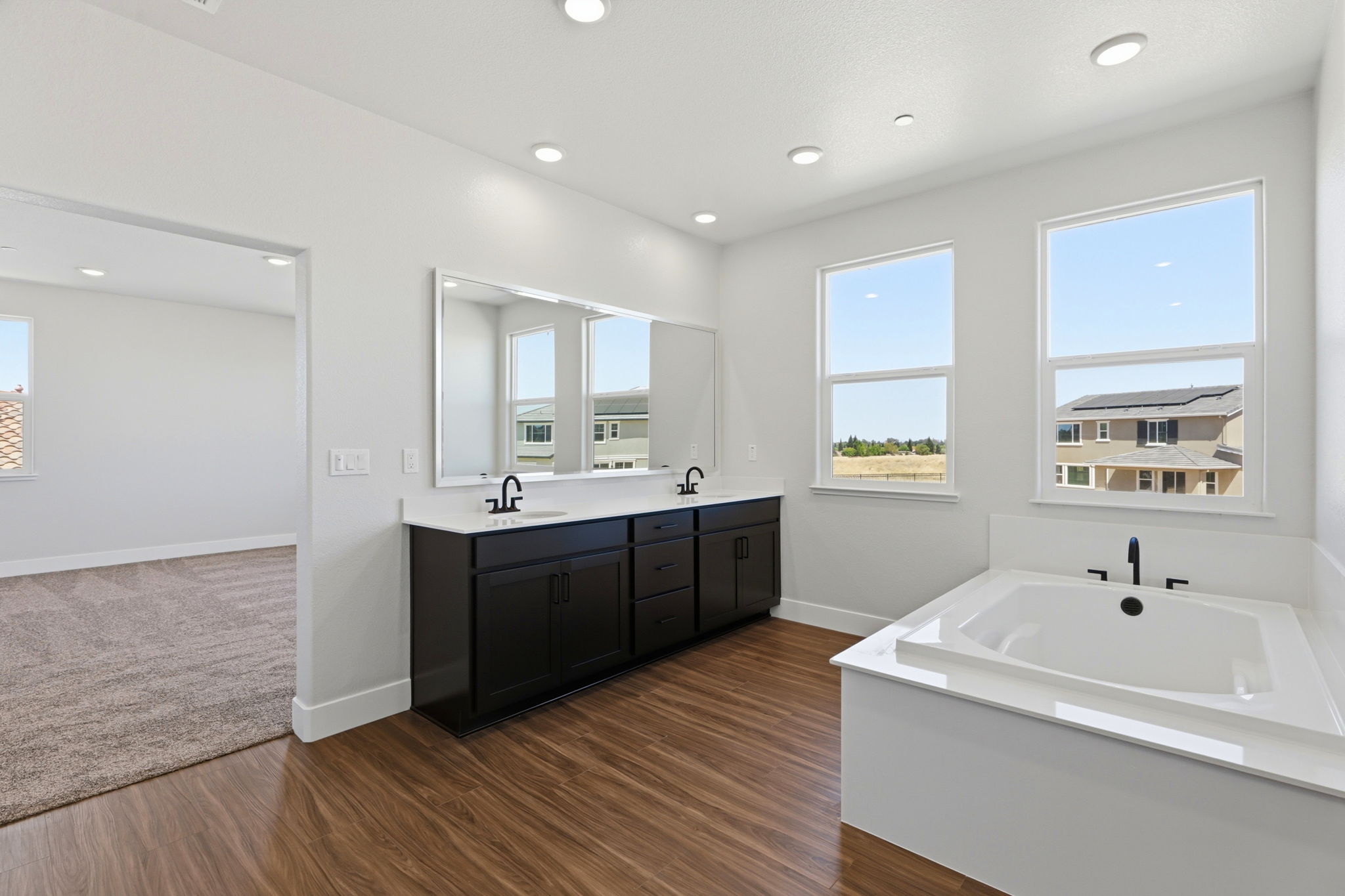 A bathroom with a tub and sink.