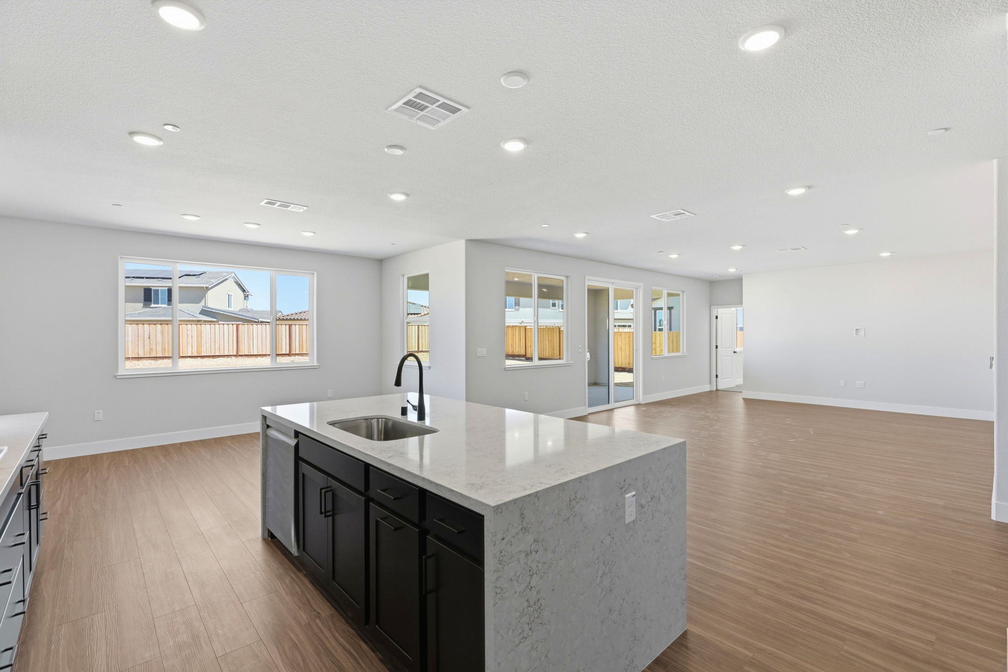 A kitchen with a marble countertop.