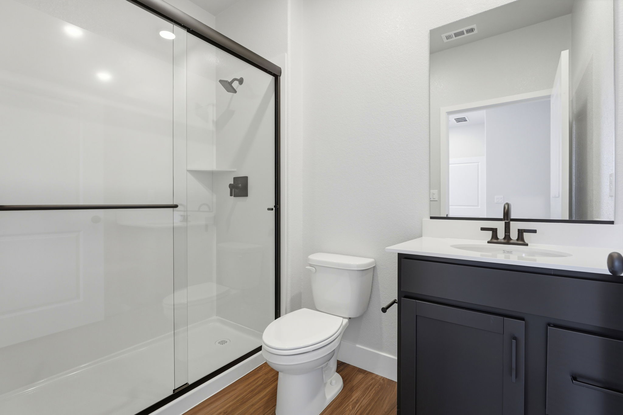 A bathroom with a glass shower.