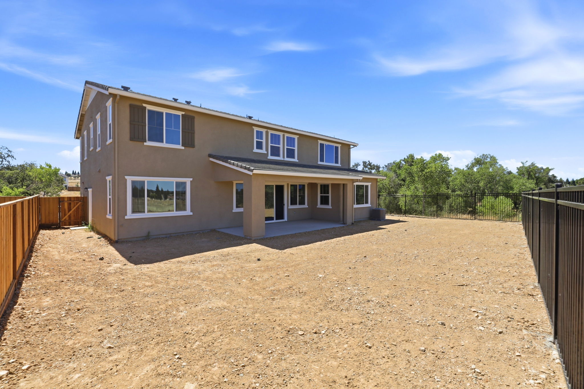 A house with a dirt yard.