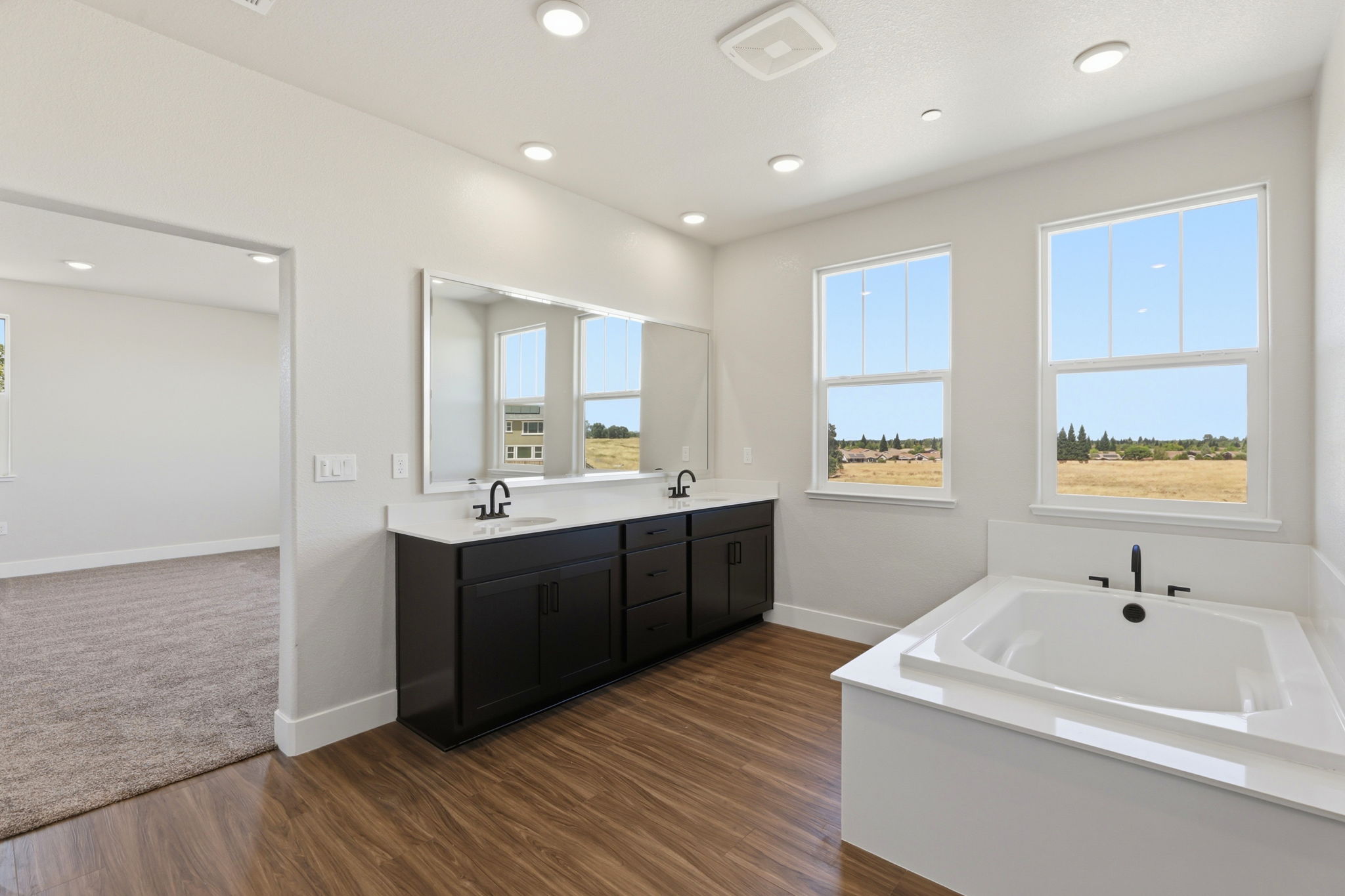 A bathroom with a tub and sink.