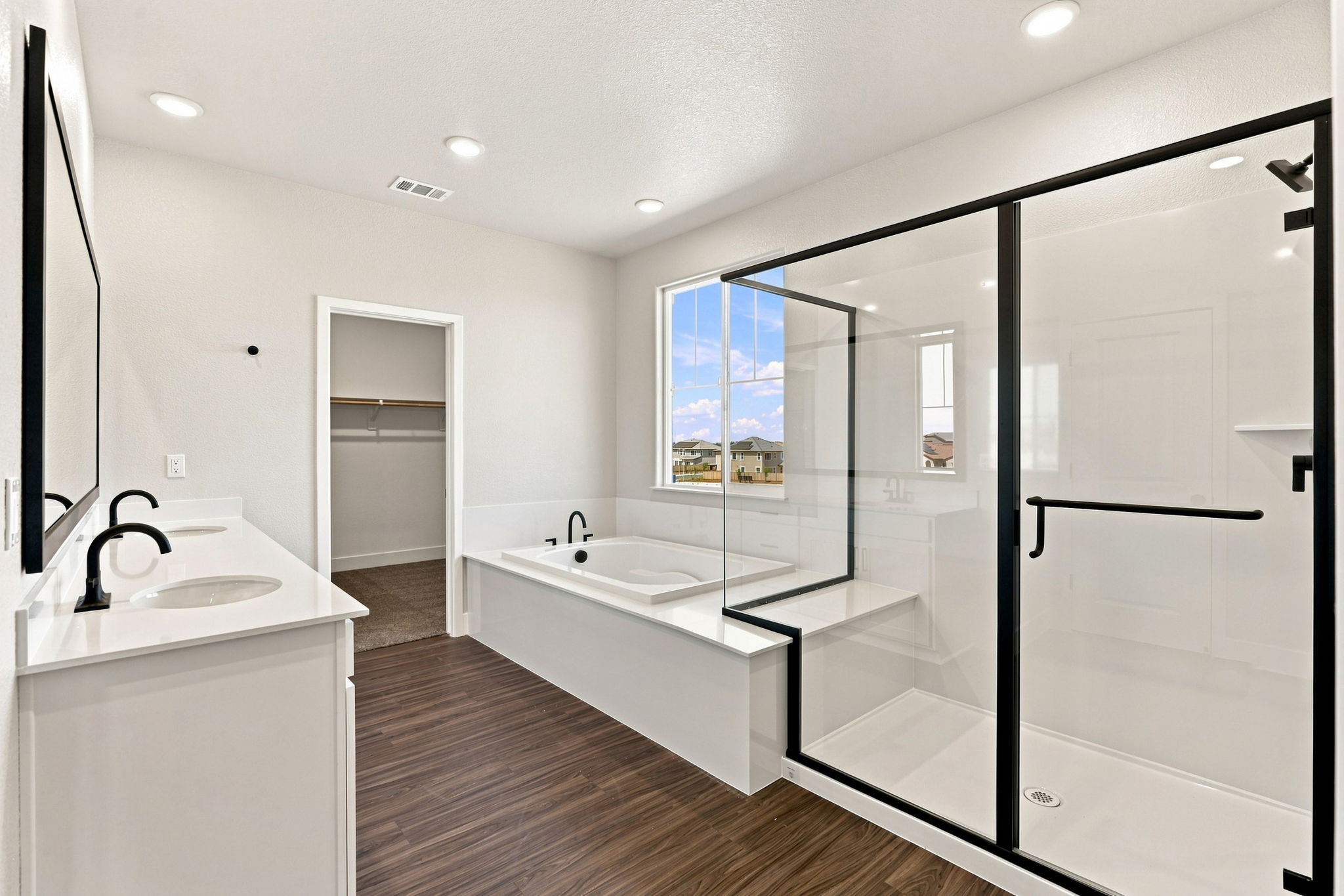 A bathroom with a glass shower.
