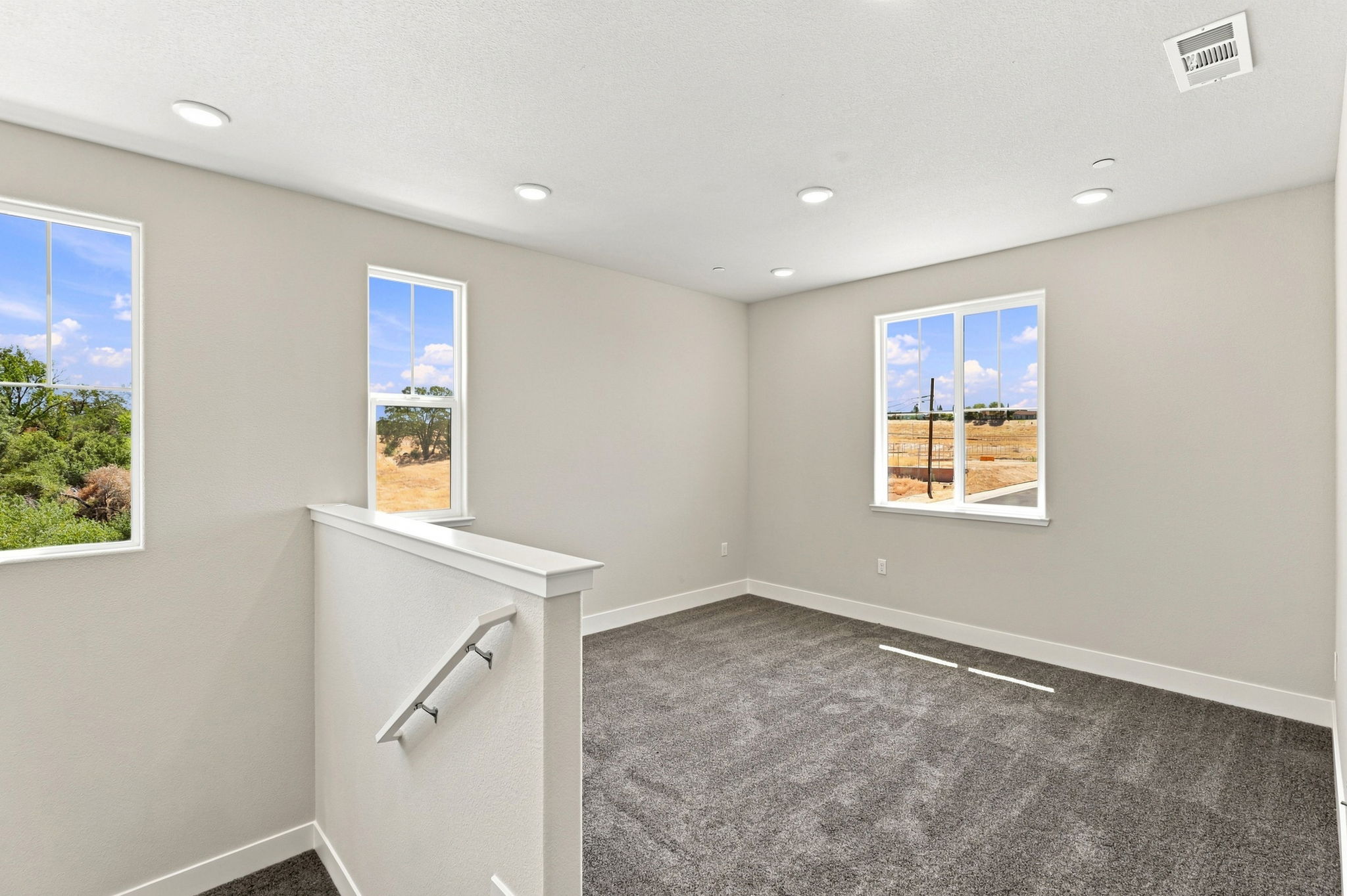 A room with a window and a sink.