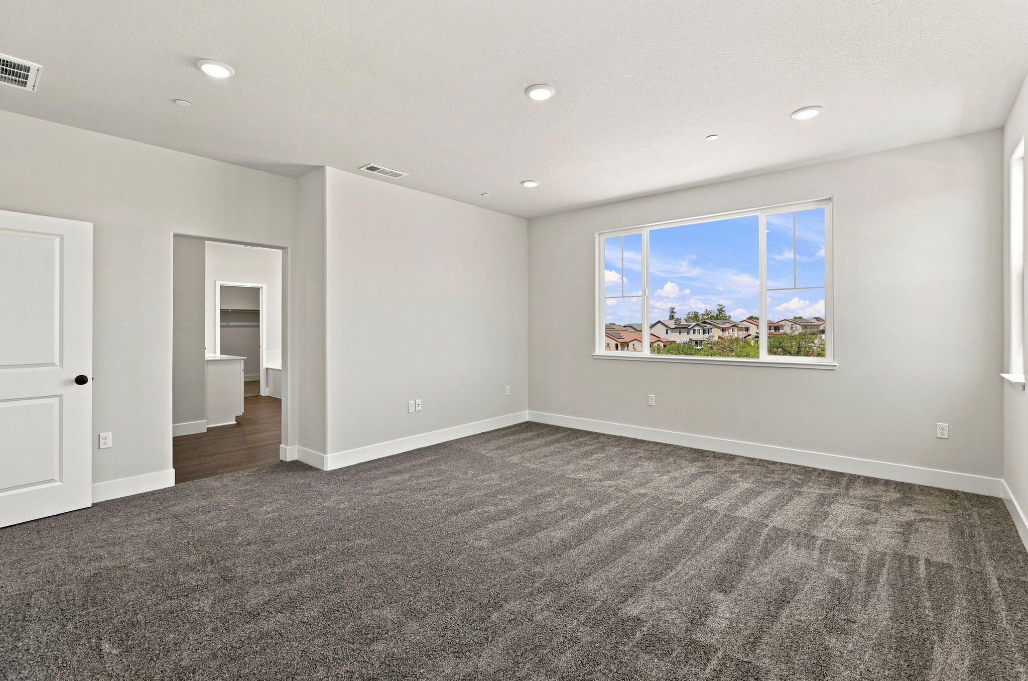 A room with a large window.