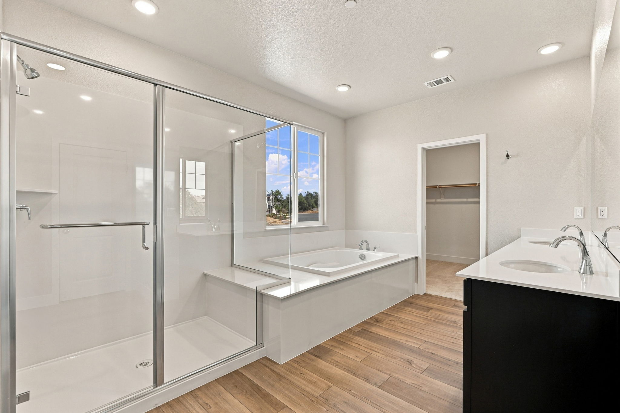 A bathroom with a glass shower.