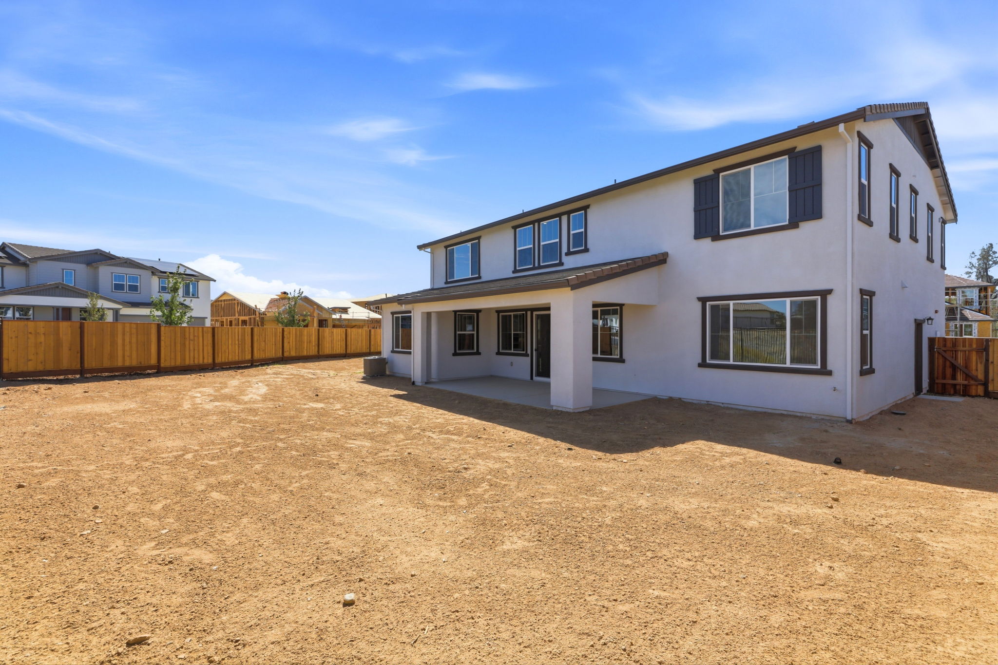 A house with a dirt yard.