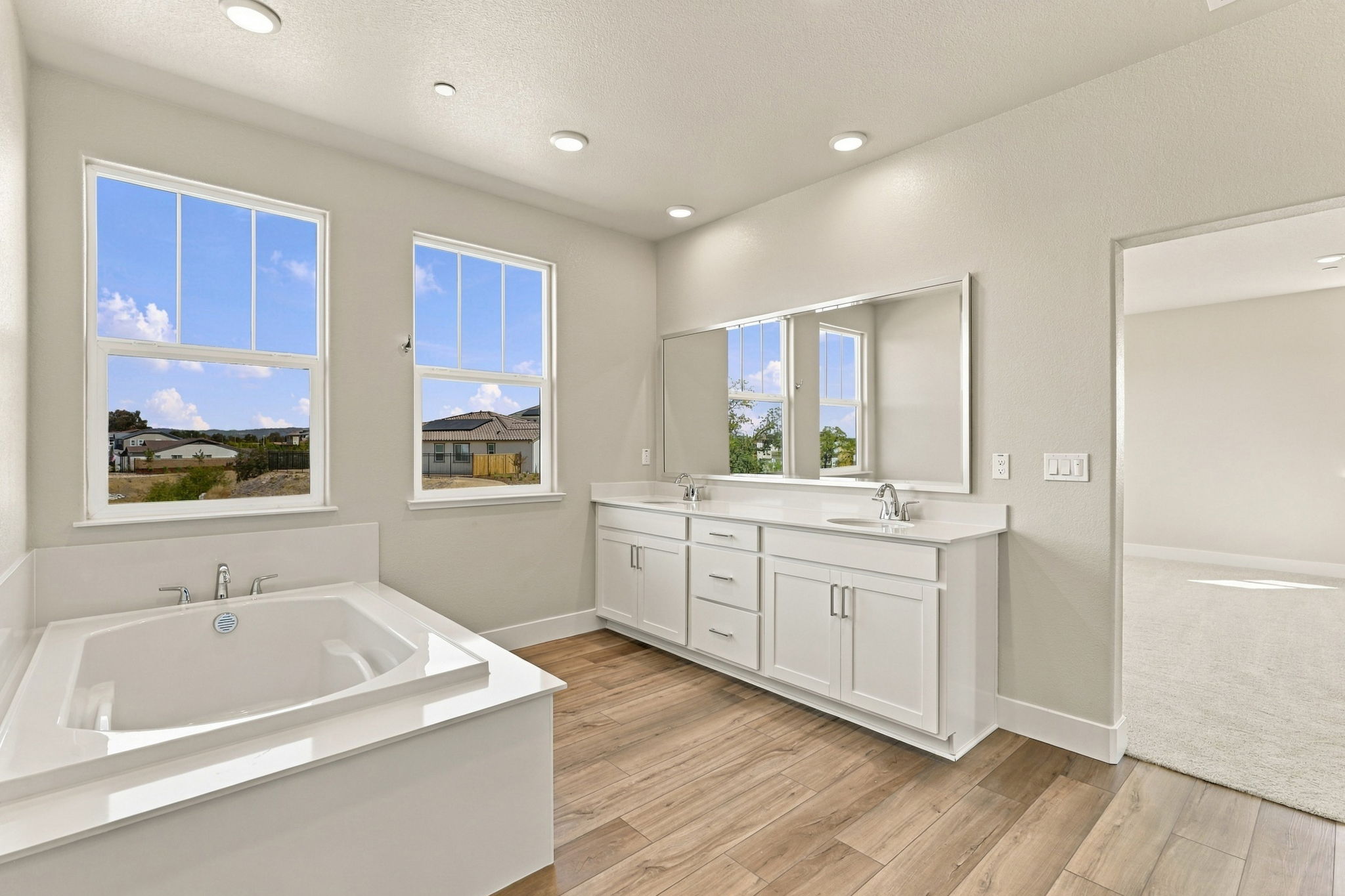 A bathroom with a tub and sink.