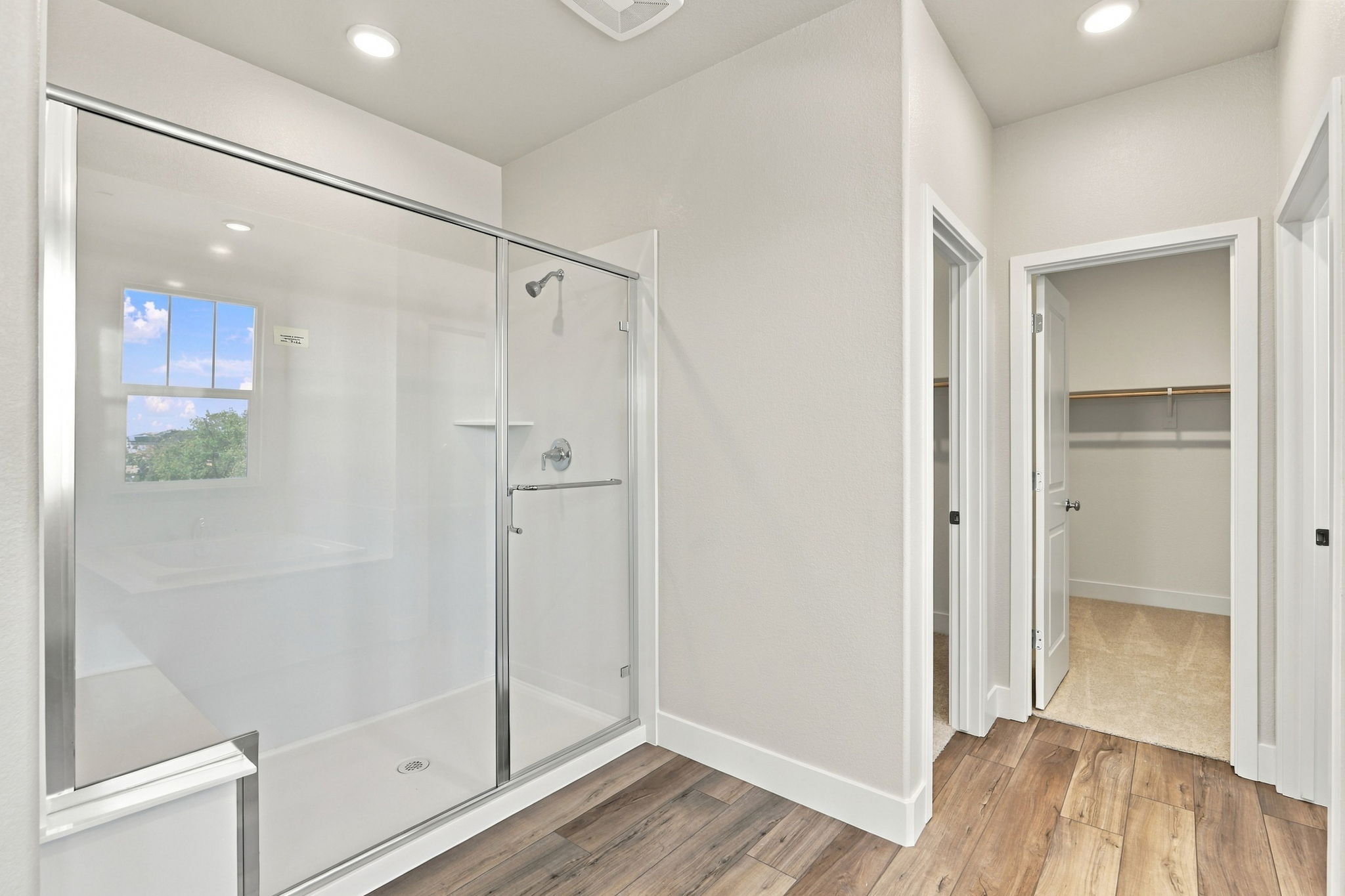 A bathroom with a glass shower.