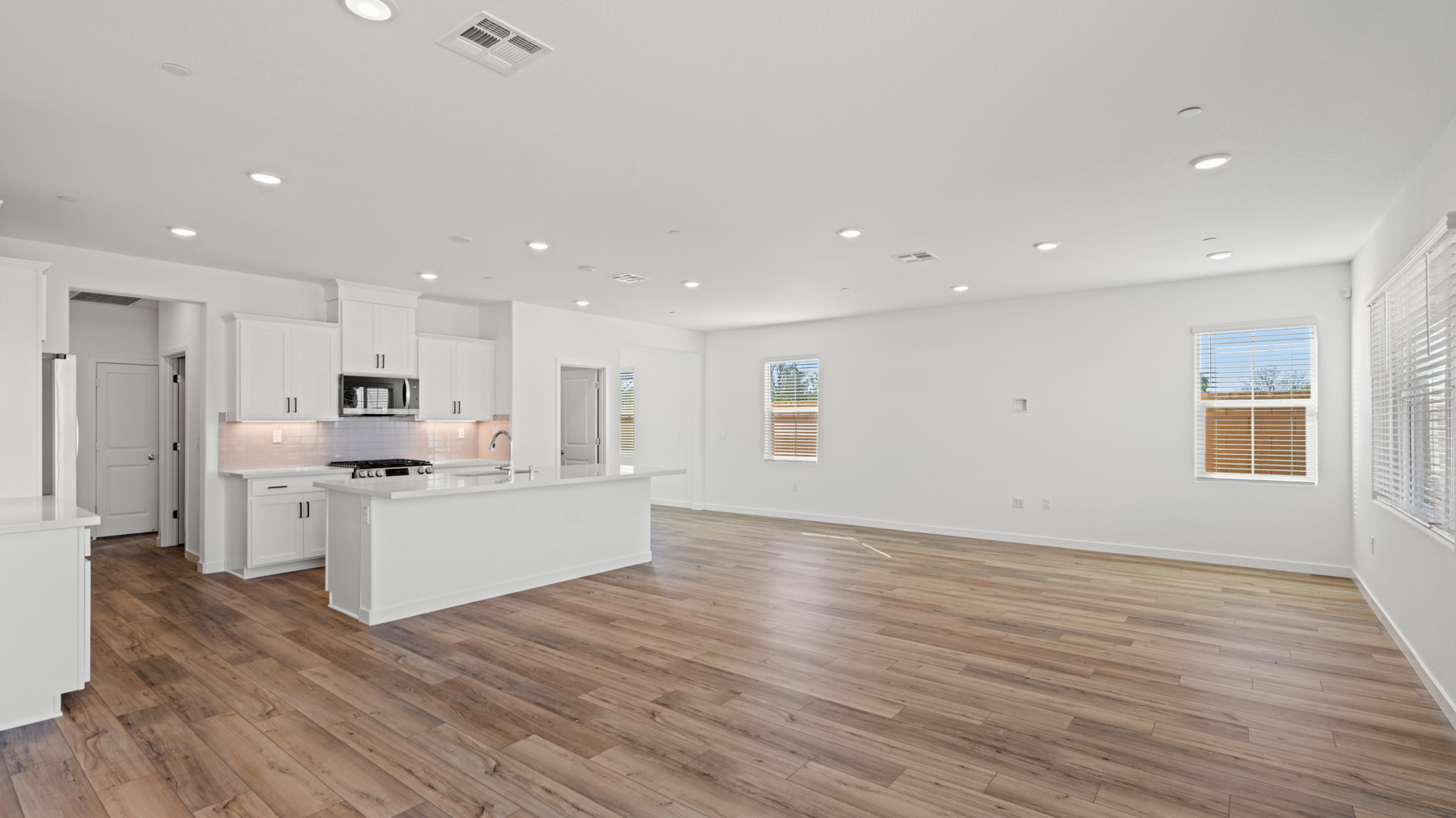 A large kitchen with white cabinets.