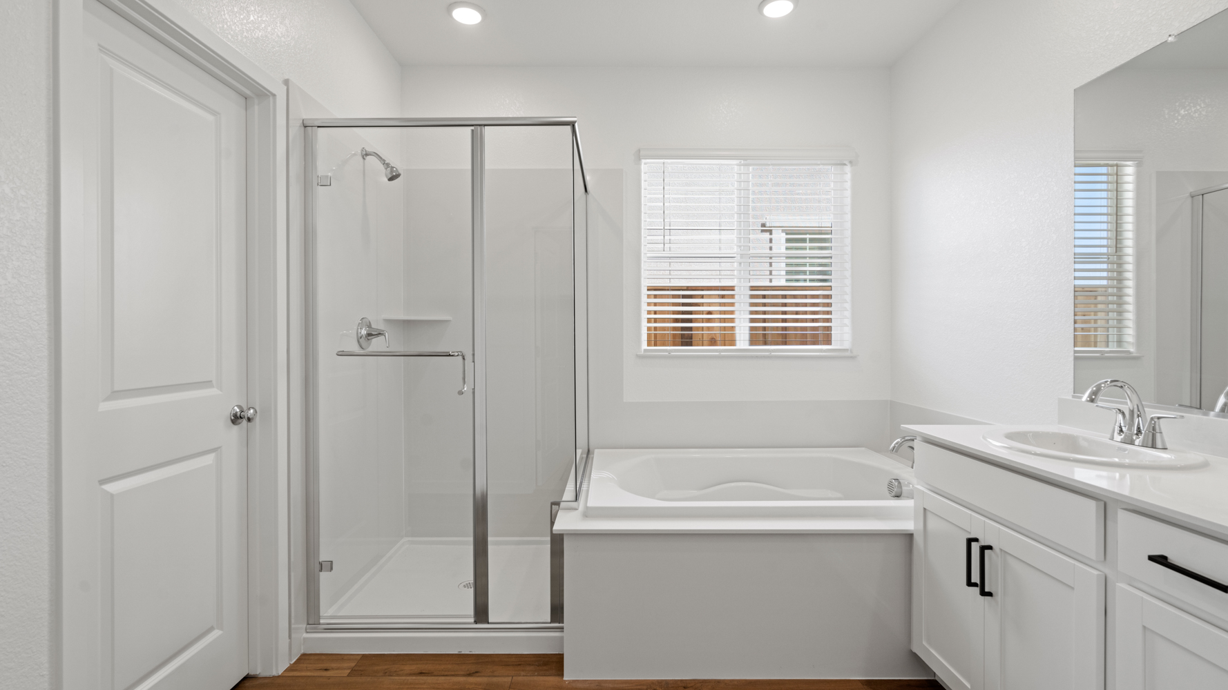 A bathroom with a glass shower.