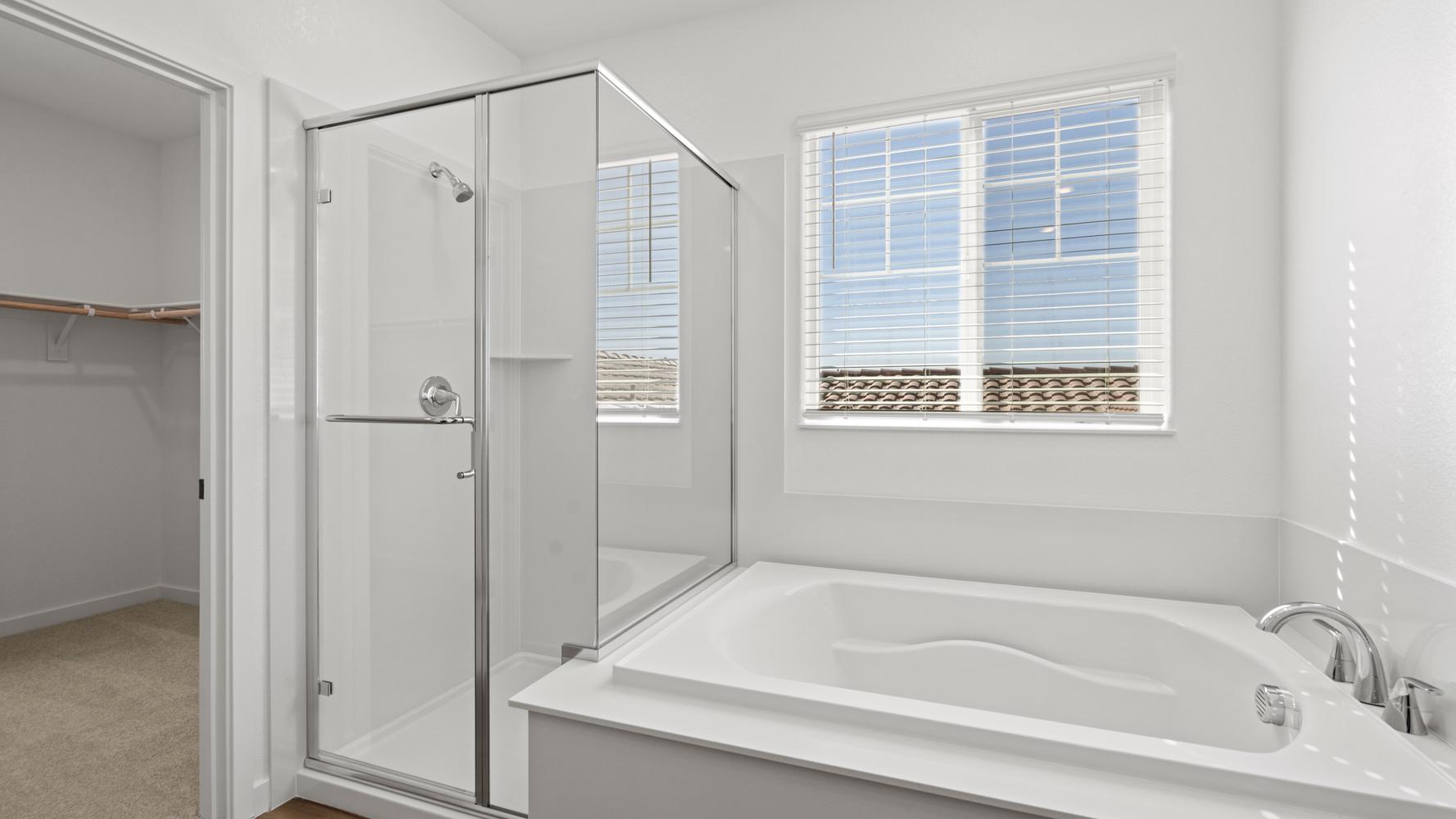 A bathroom with a bathtub and shower.