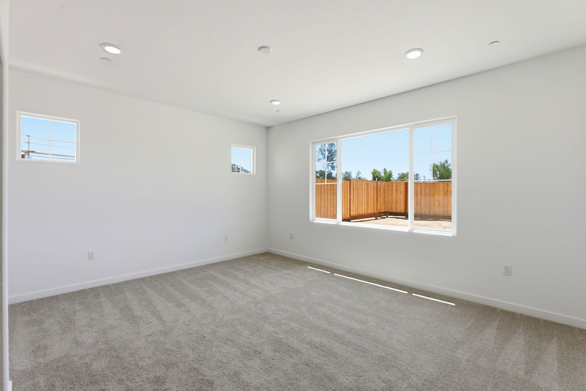 A room with a window and a door.