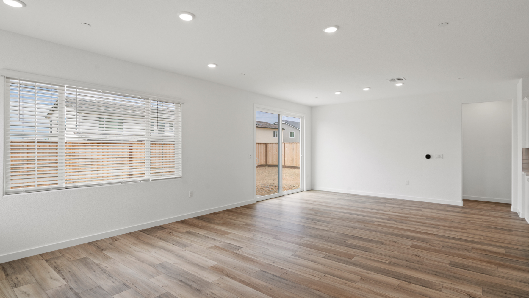 A room with a wood floor and a wood floor.