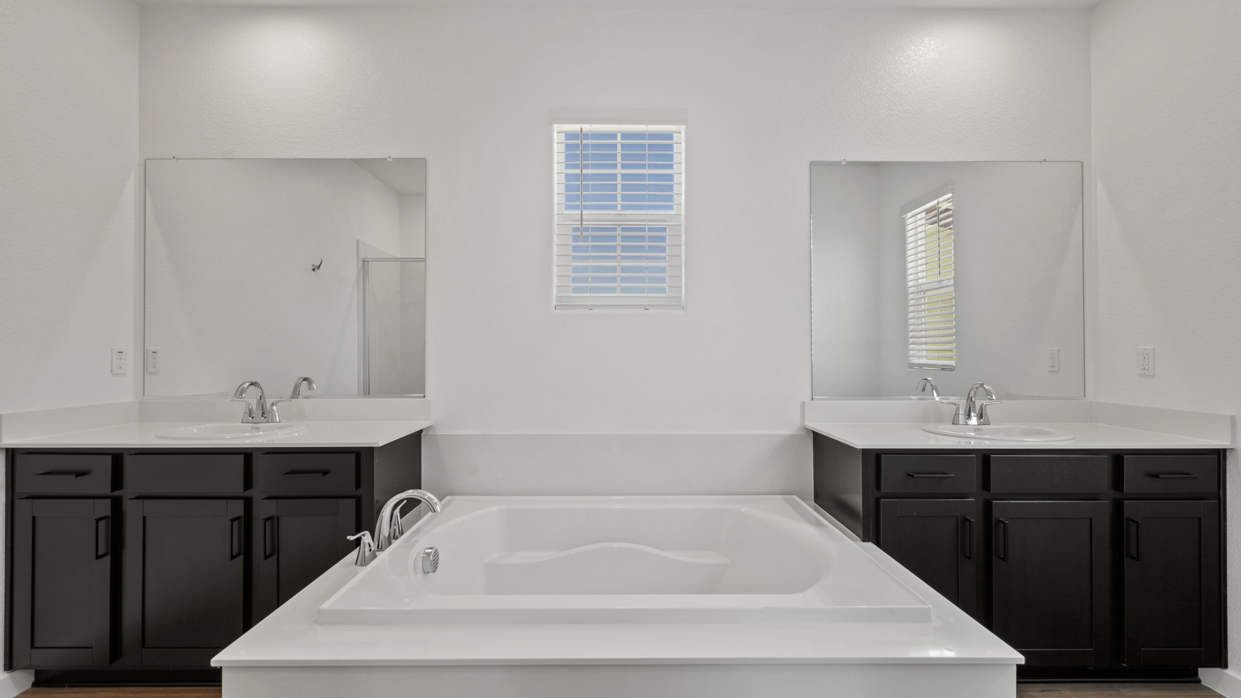 A bathroom with a tub and sink.