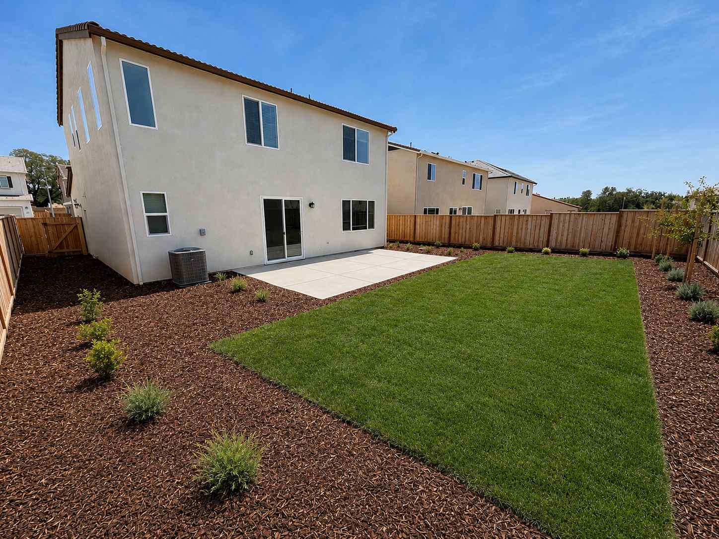 A house with a fence and yard.