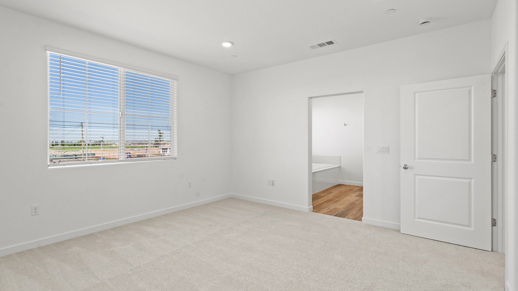 A room with a door and a window.