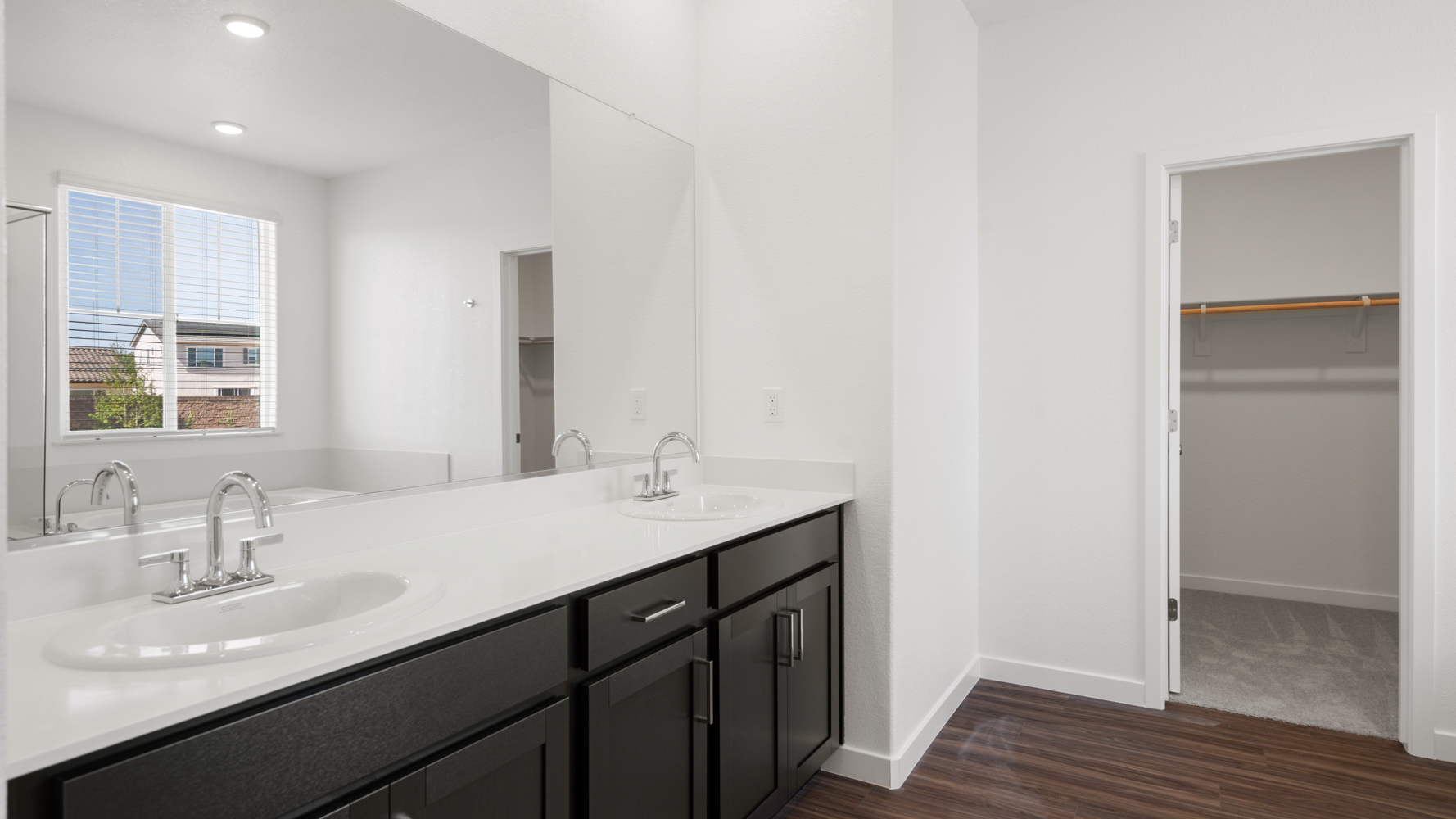 A bathroom with a sink and a mirror.