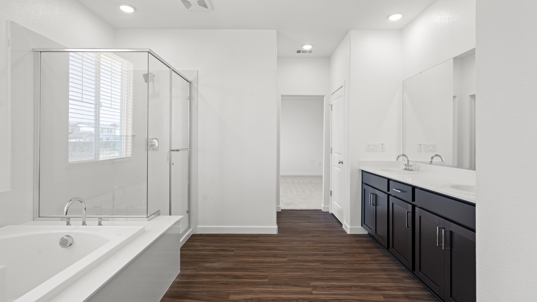 A bathroom with a tub and sink.
