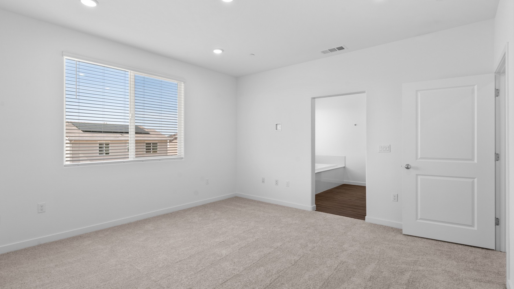 A room with a door and a window.