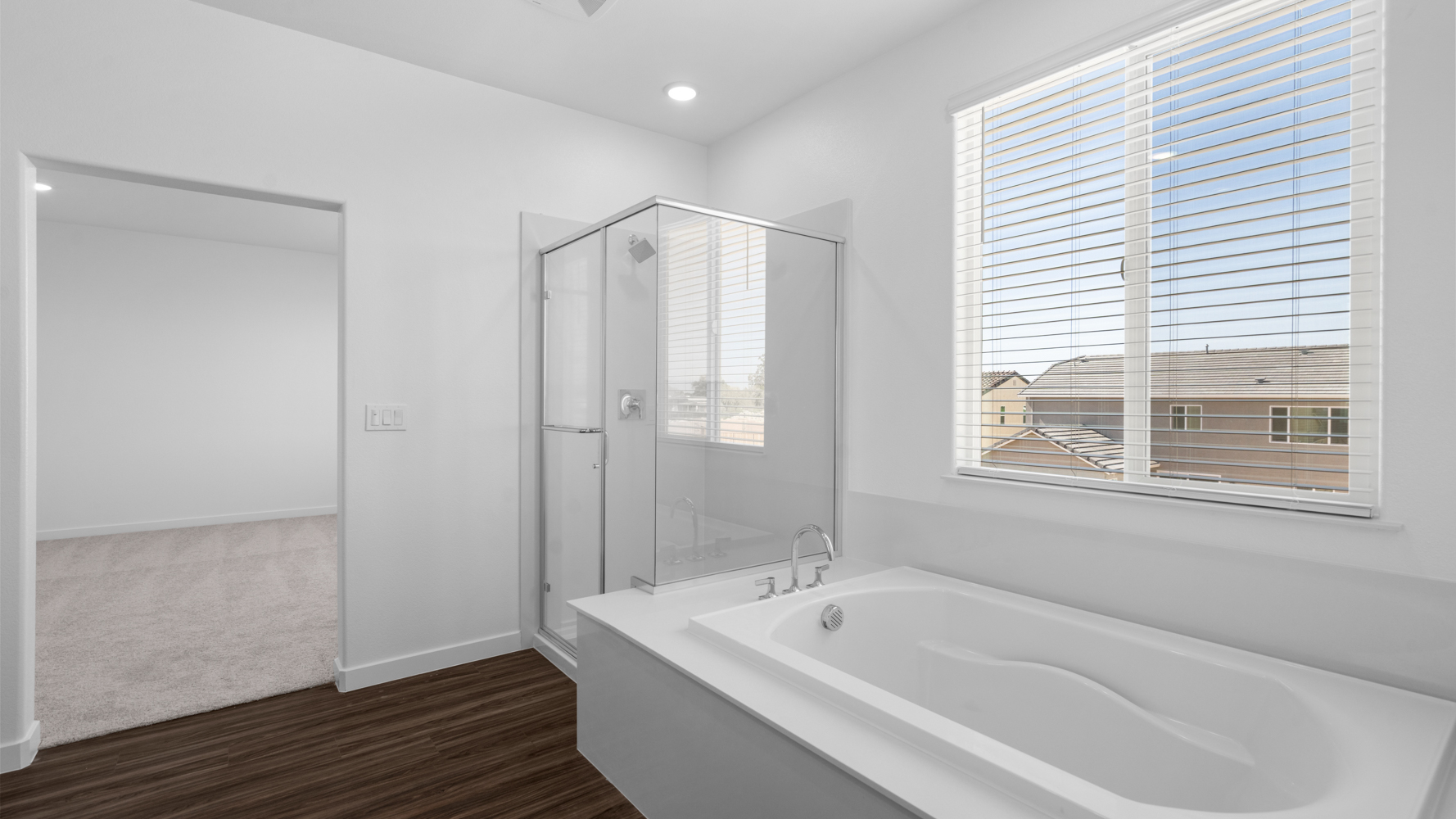 A bathroom with a tub and shower.