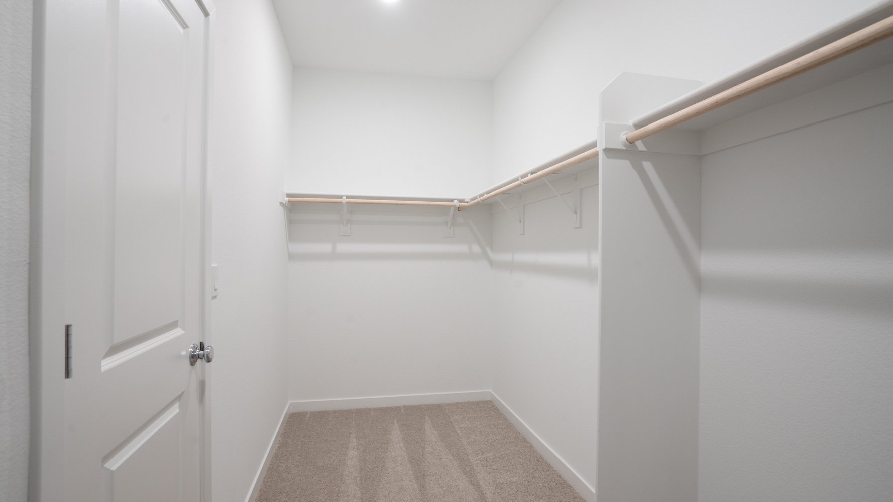 A hallway with white walls.