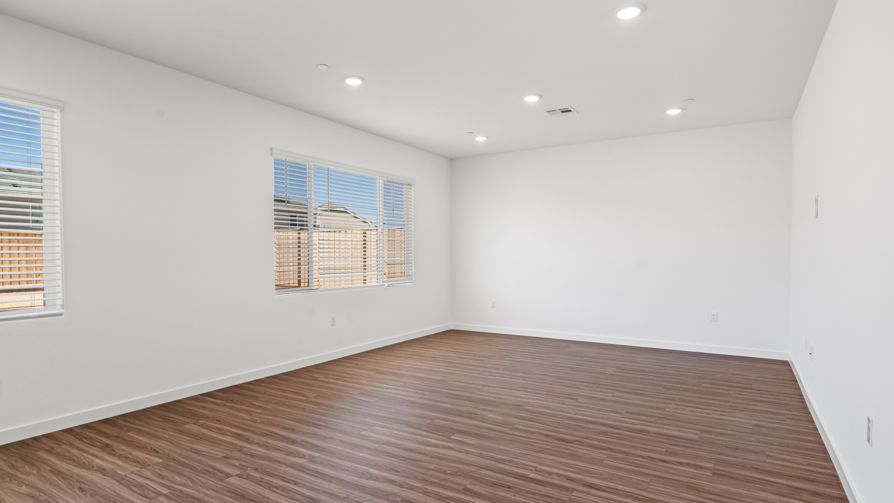 A room with a wood floor and a wood floor.