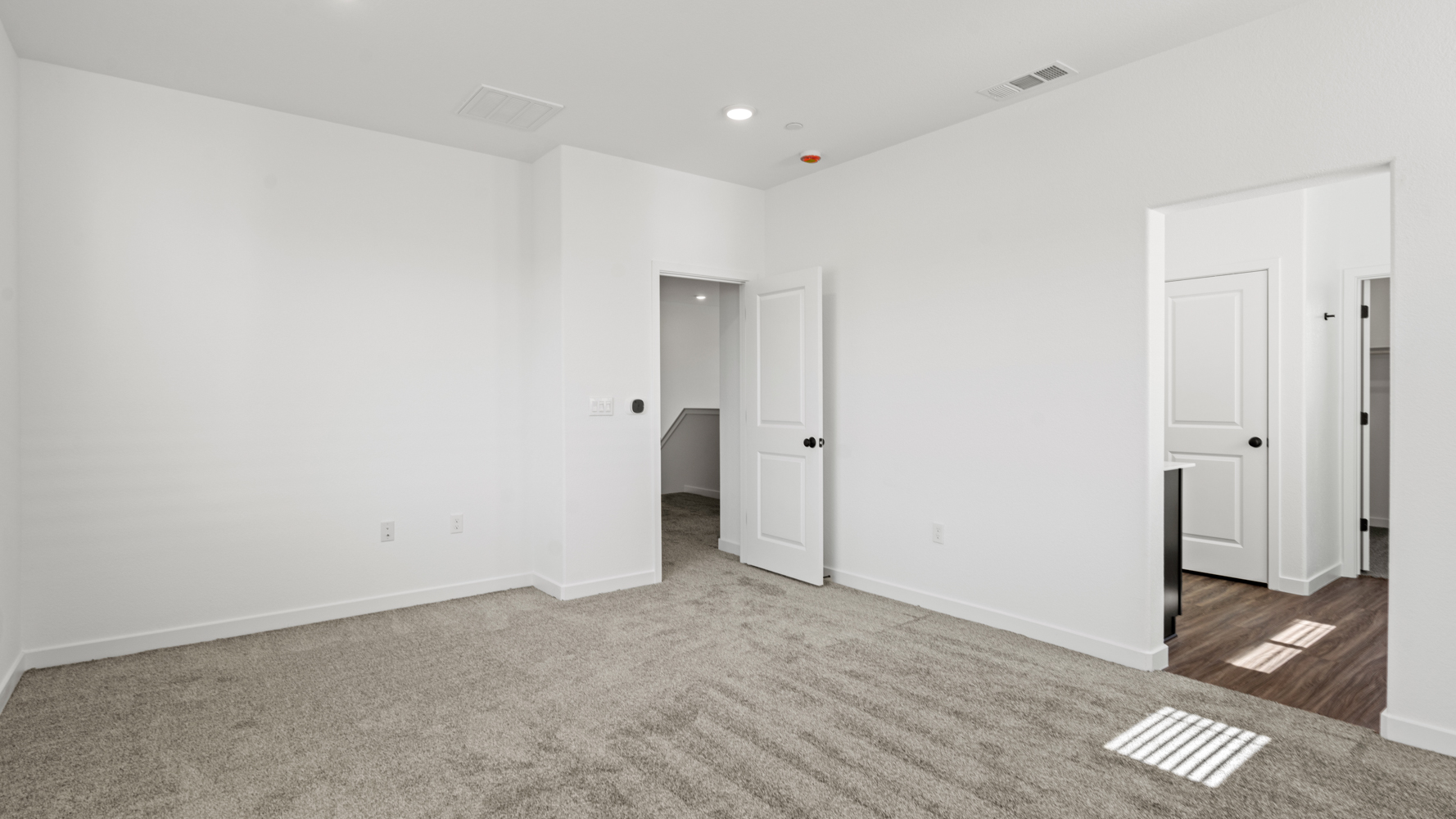 A room with white doors.