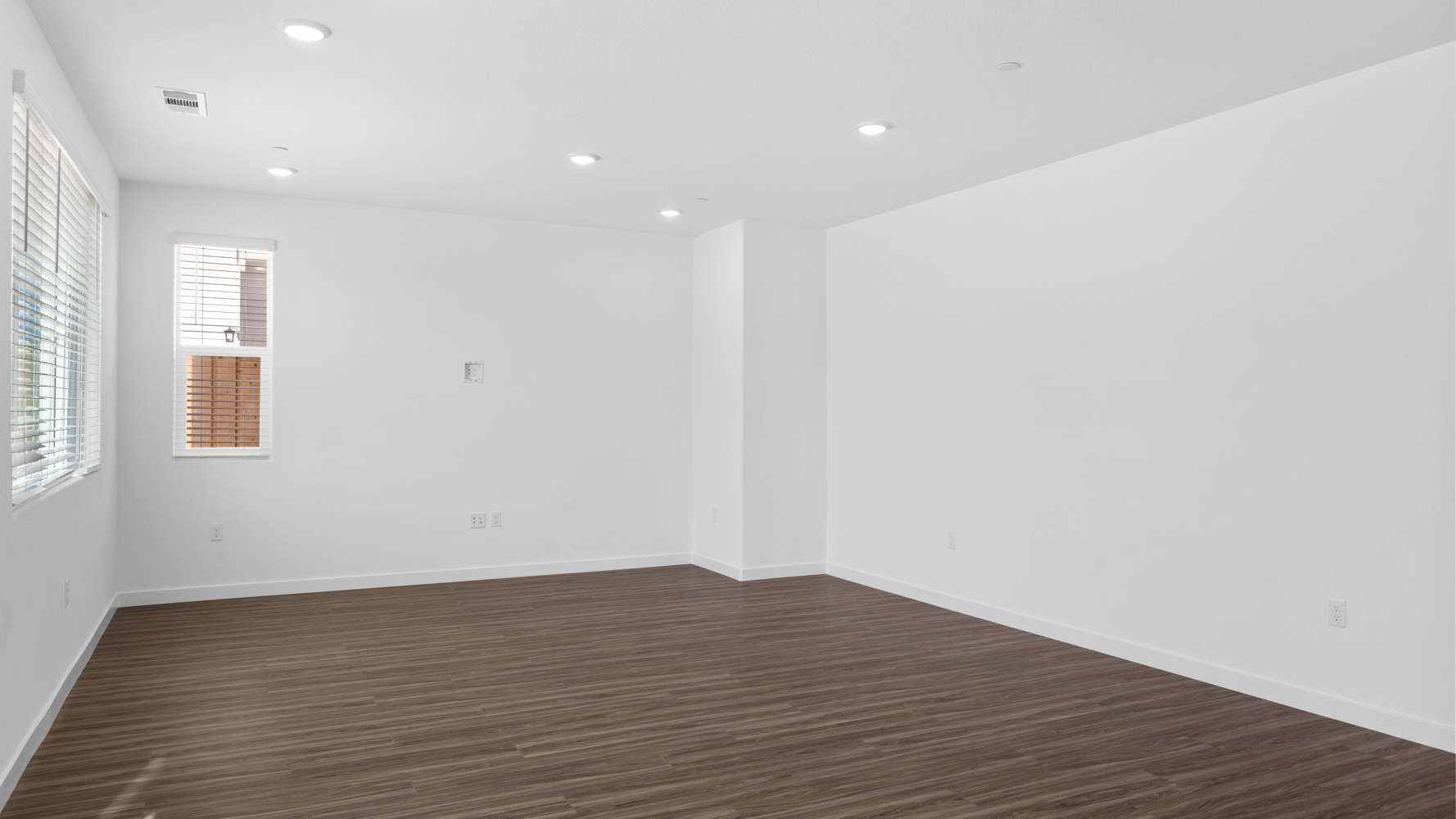 A room with a wood floor and a wood floor.