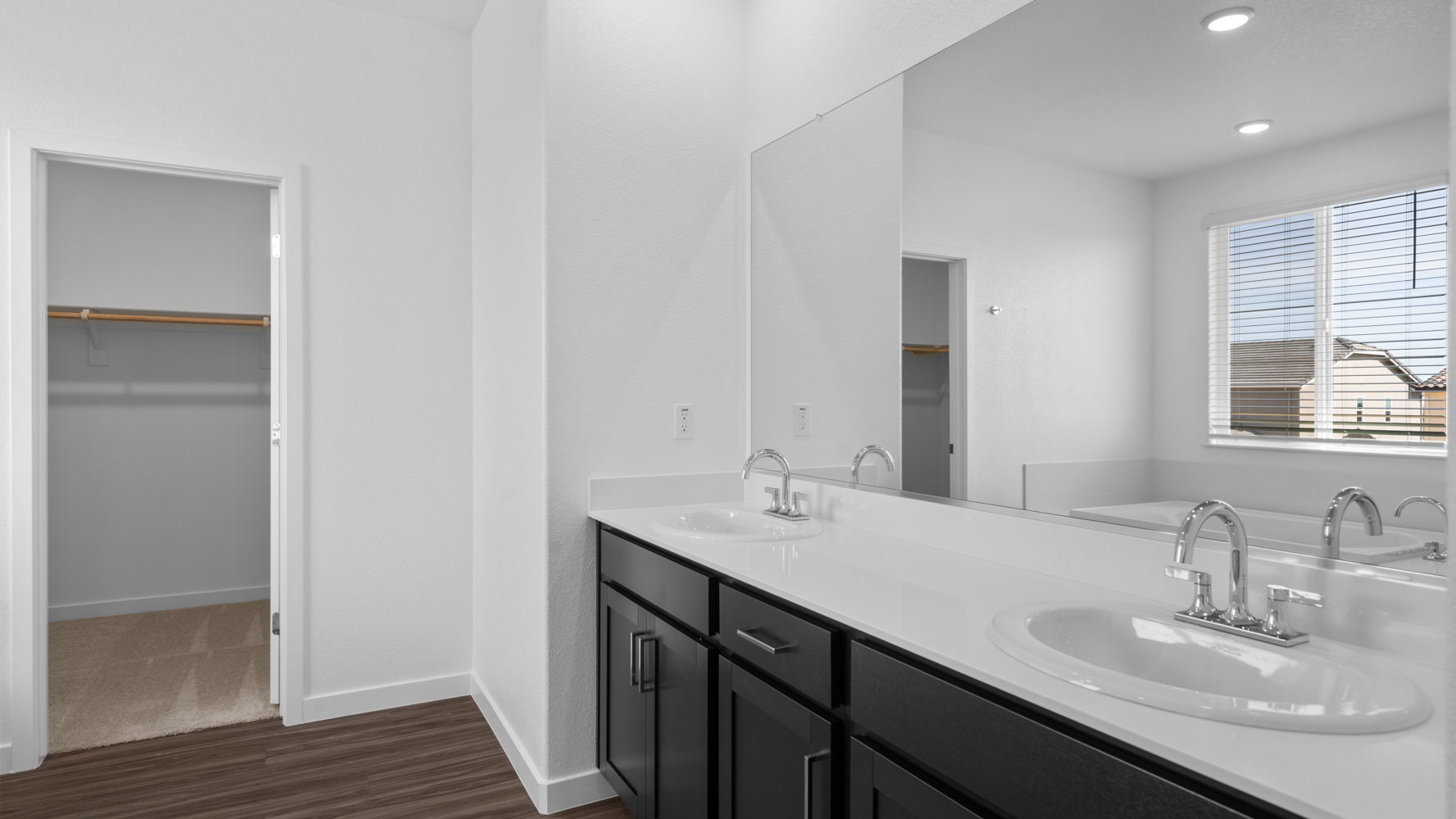 A bathroom with a large mirror.