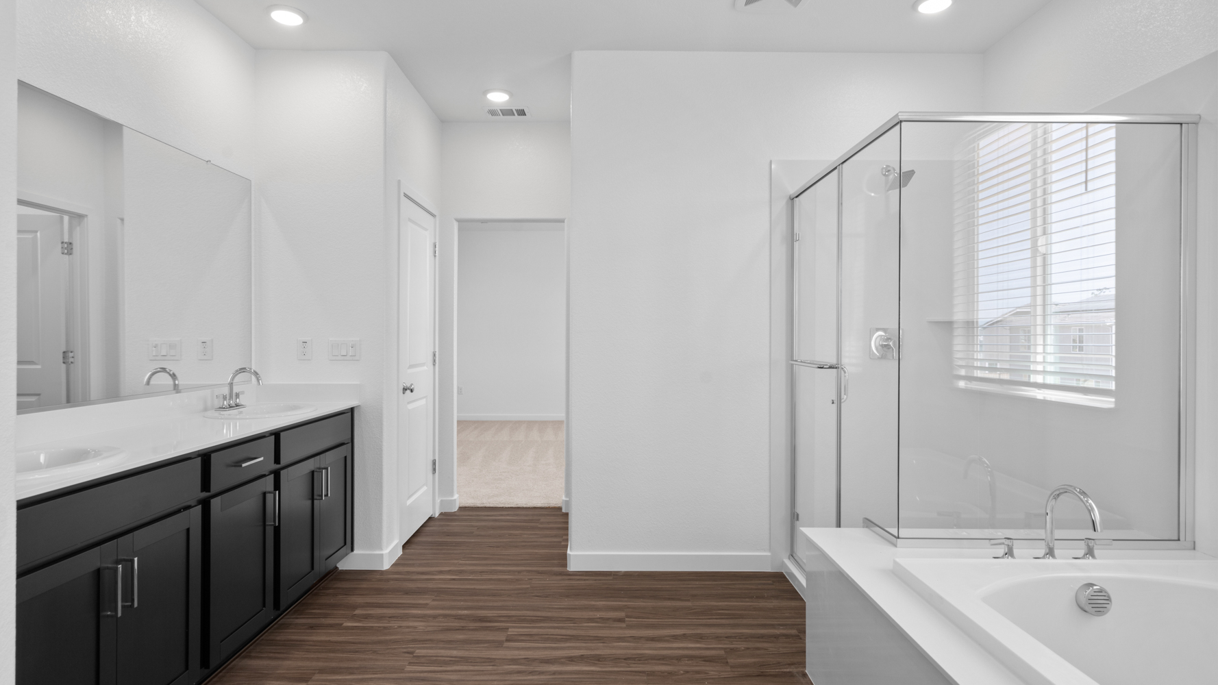 A bathroom with a glass shower.