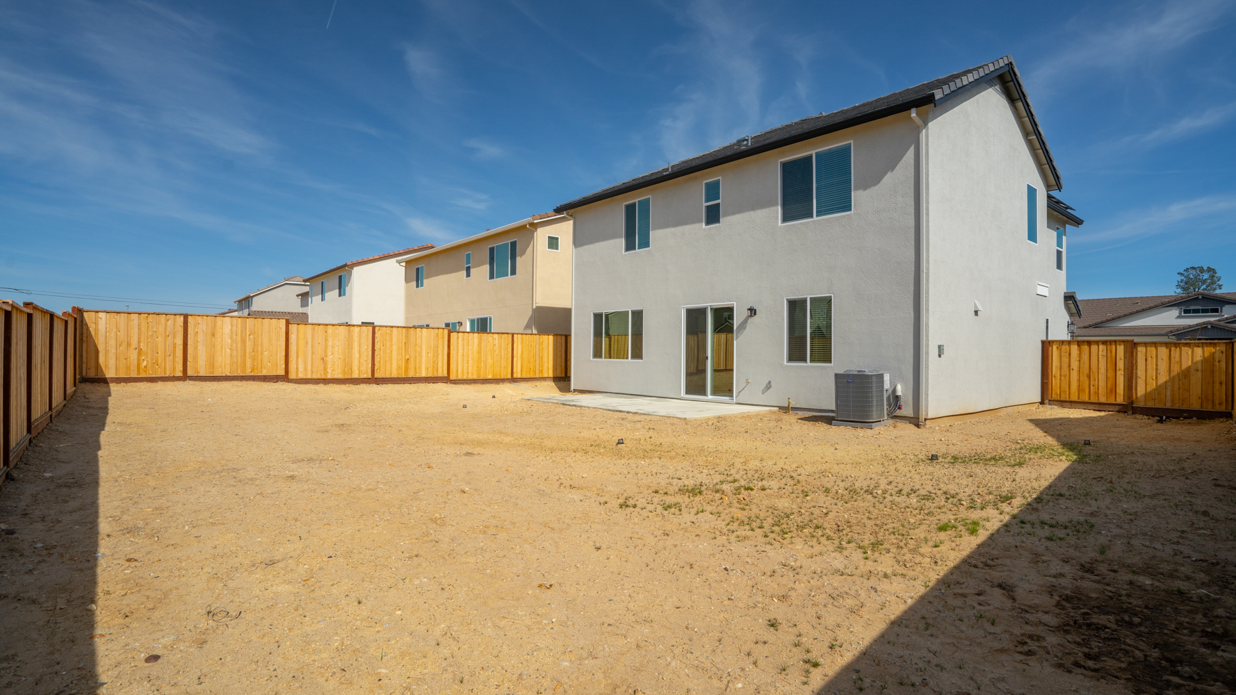 A white house with a fence.