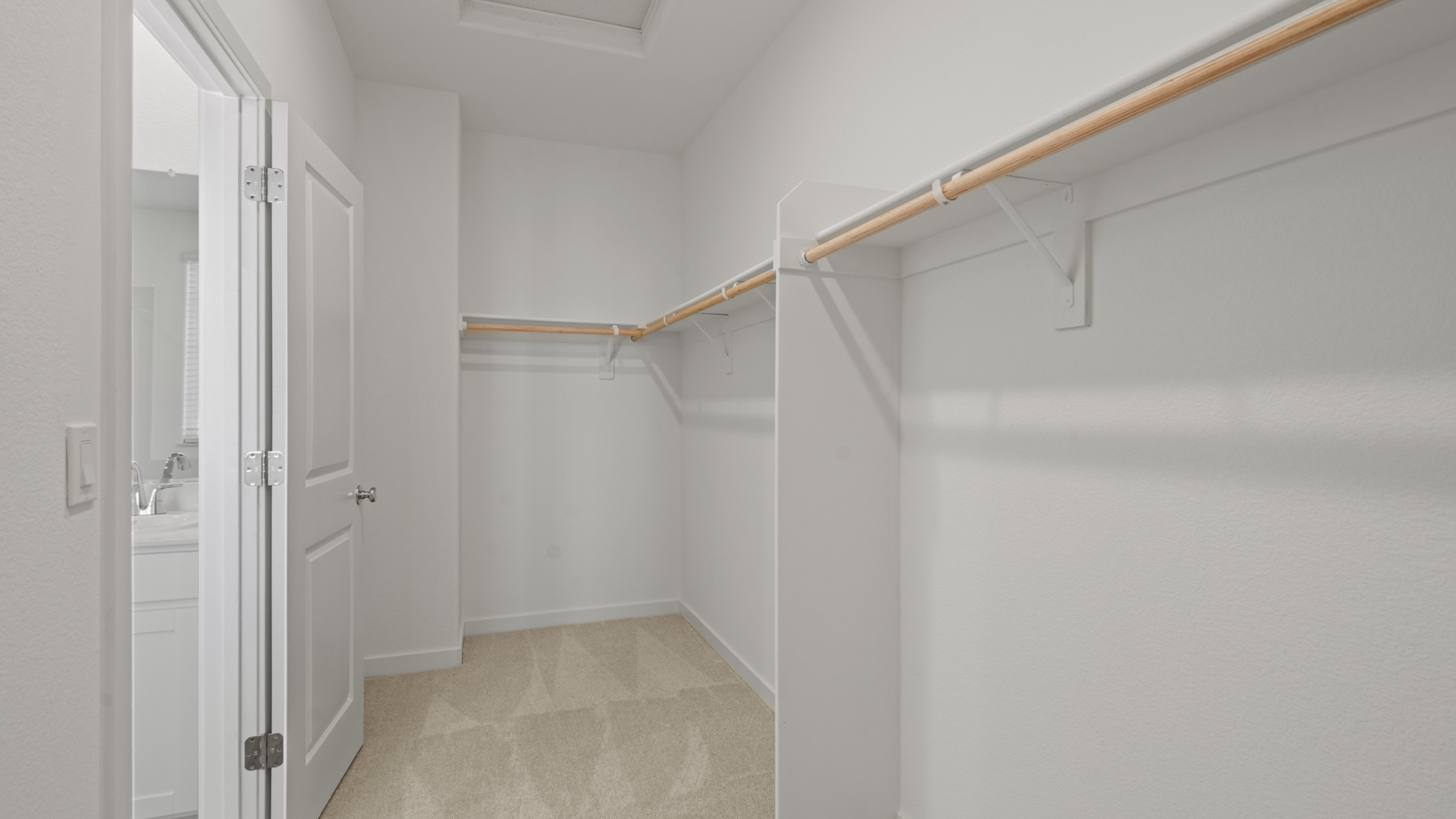 A bathroom with white walls.