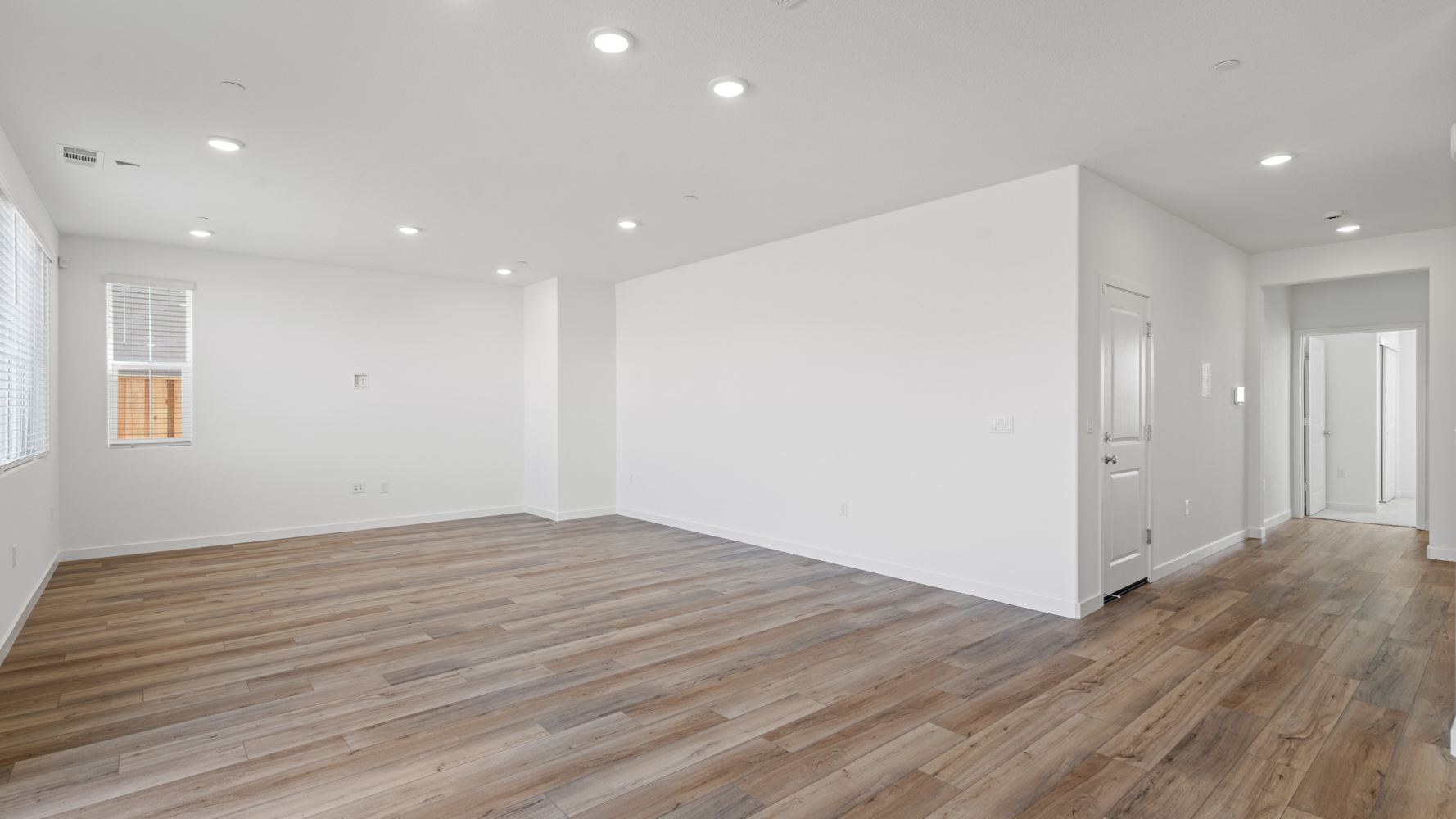 A room with wood floors.