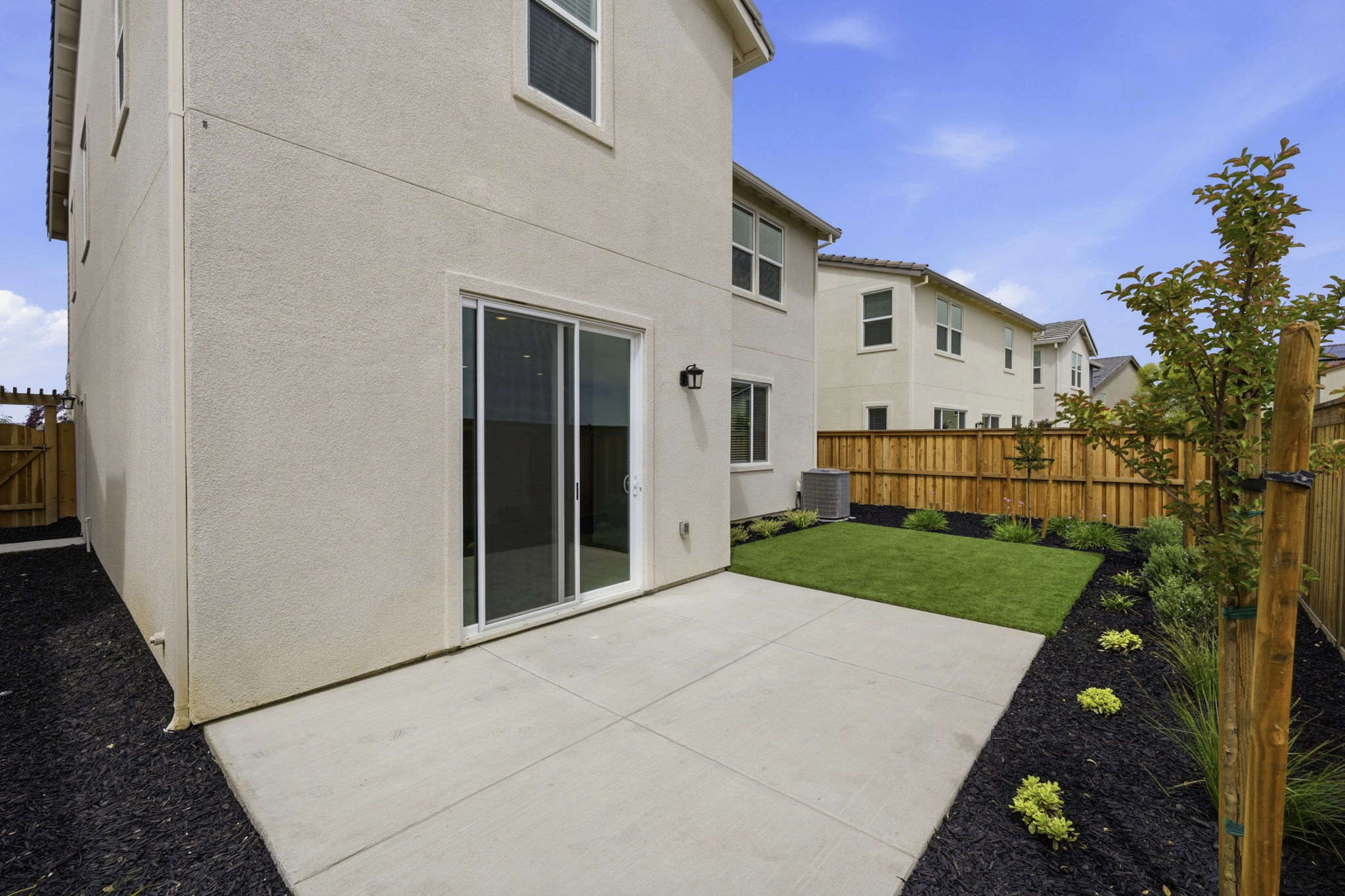 A white house with a fence.