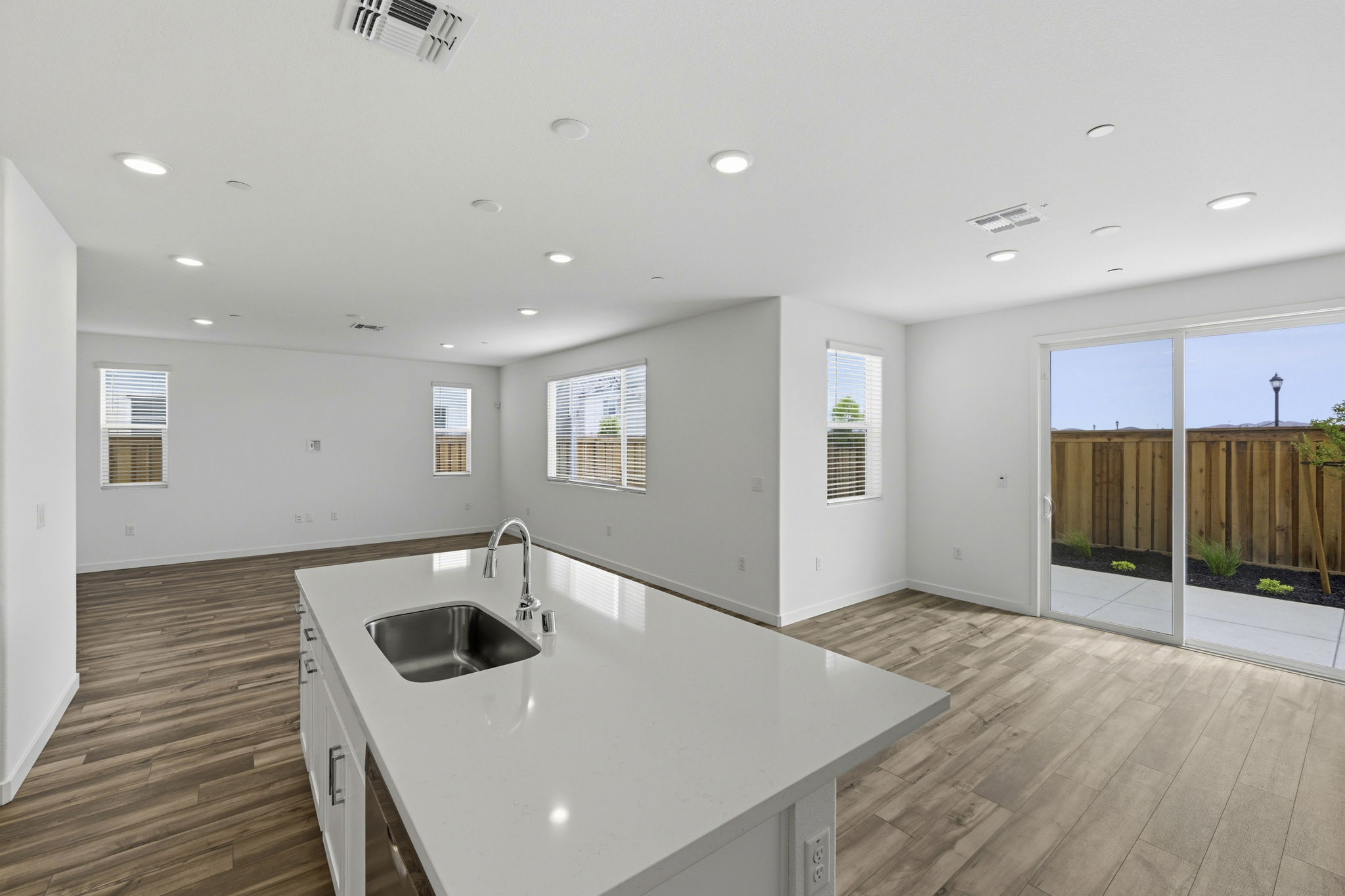 A kitchen with a large glass door.