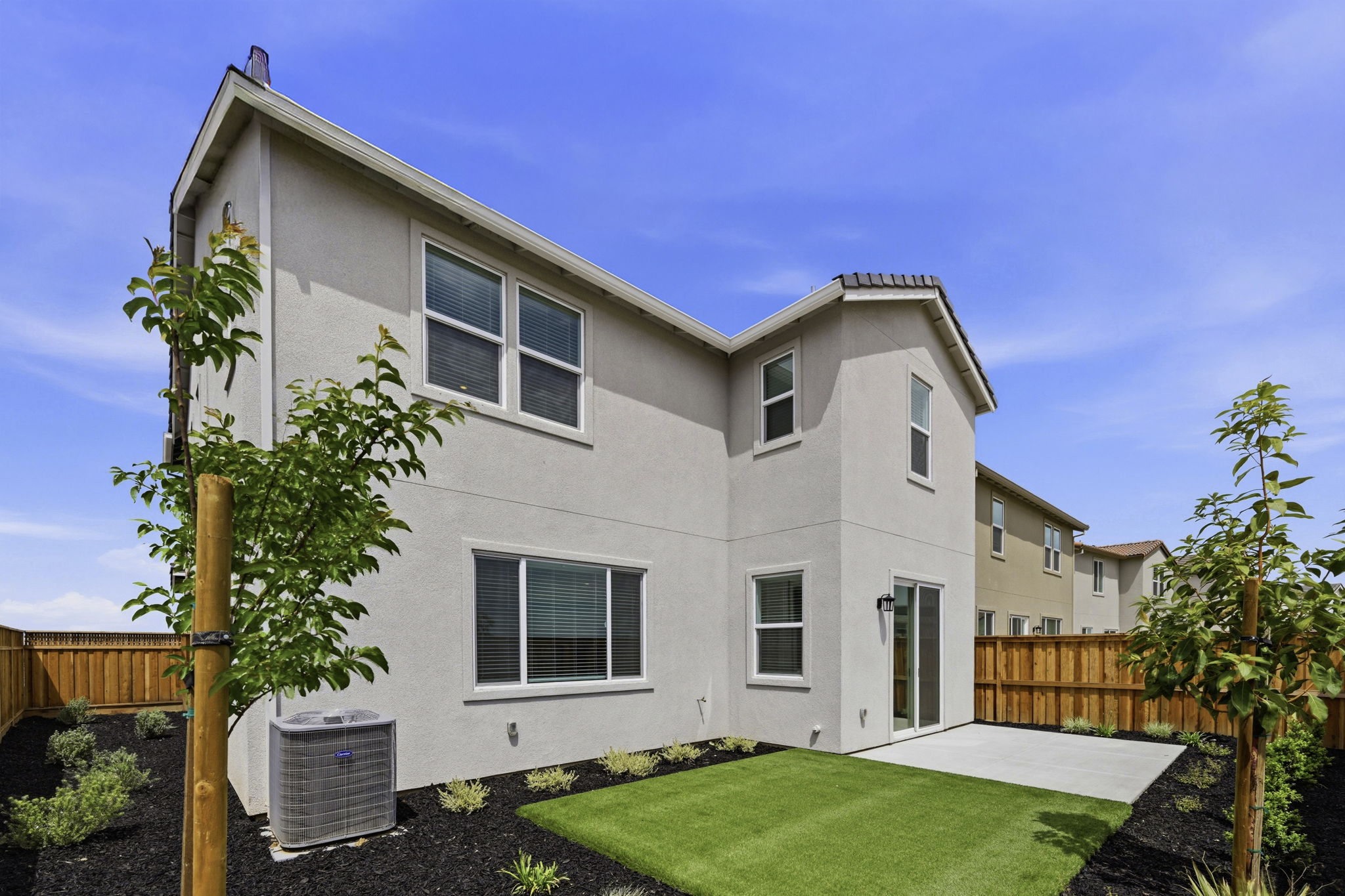 A house with a green lawn.