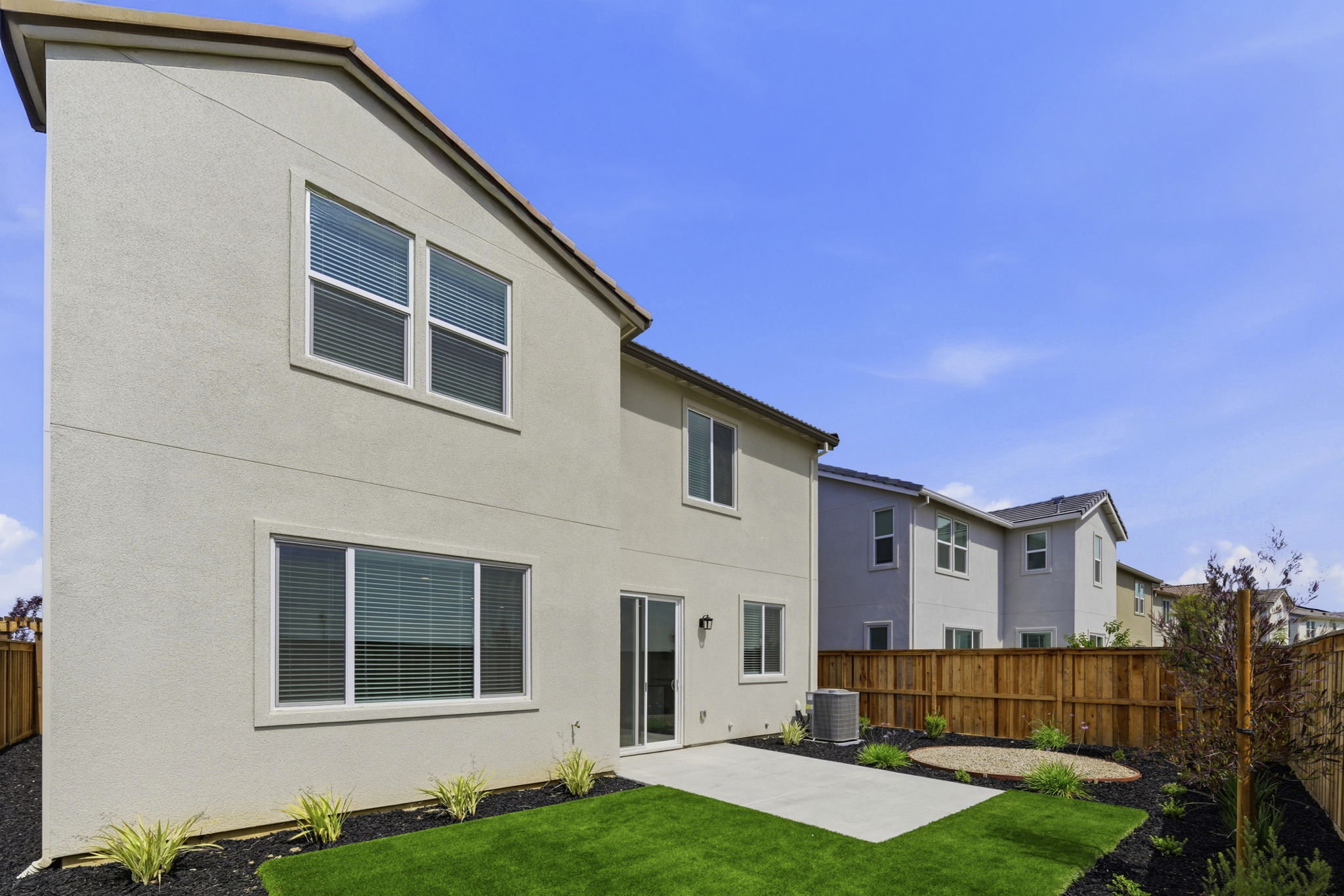 A house with a fence and yard.