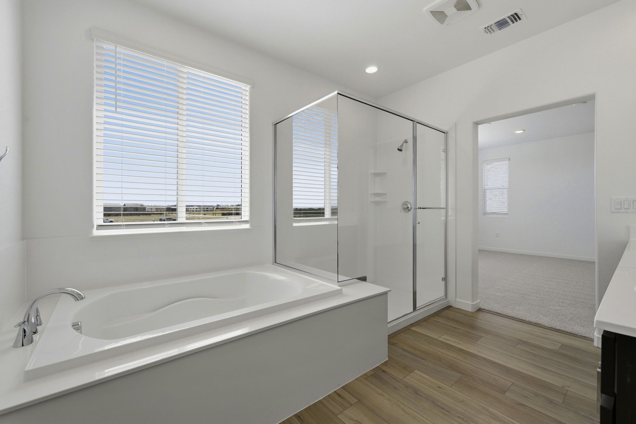 A bathroom with a tub and shower.