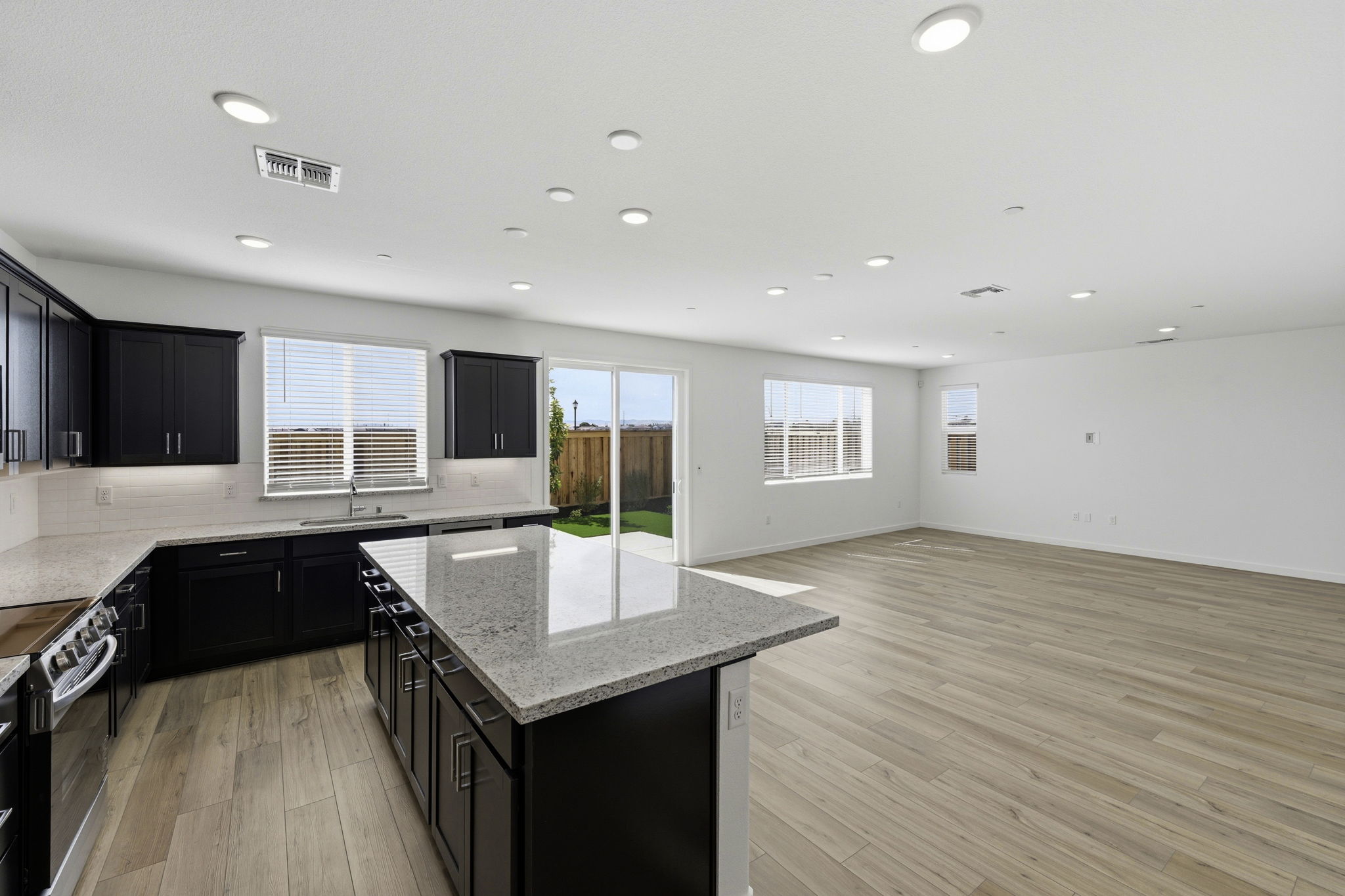 A kitchen with black appliances.