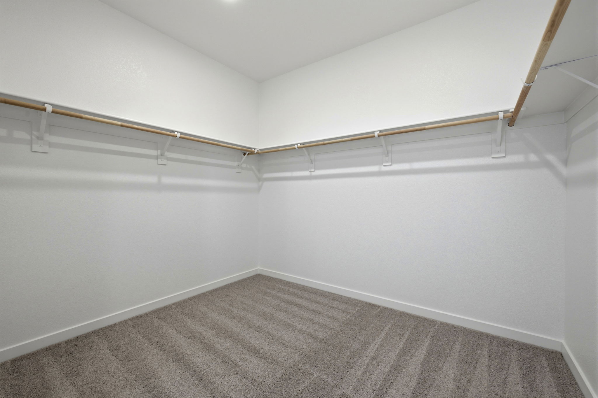 A white room with a carpet.