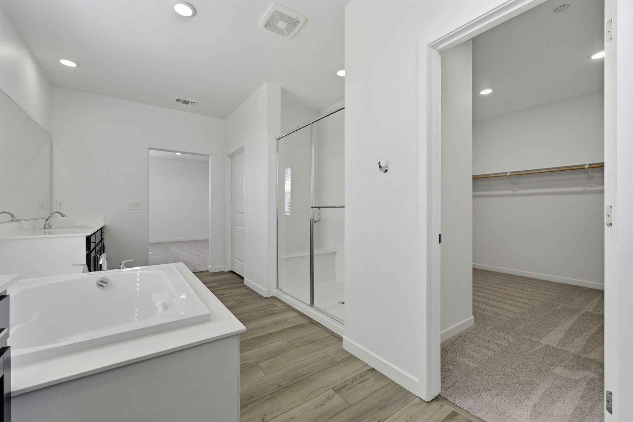 A bathroom with a tub and shower.