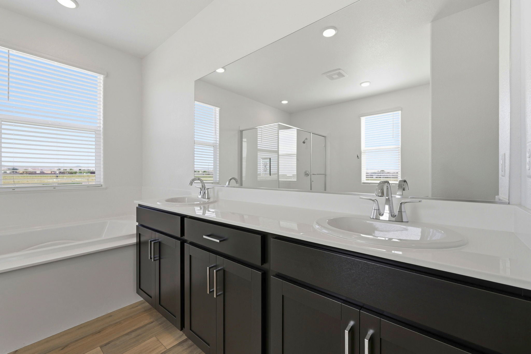 A bathroom with a large mirror.