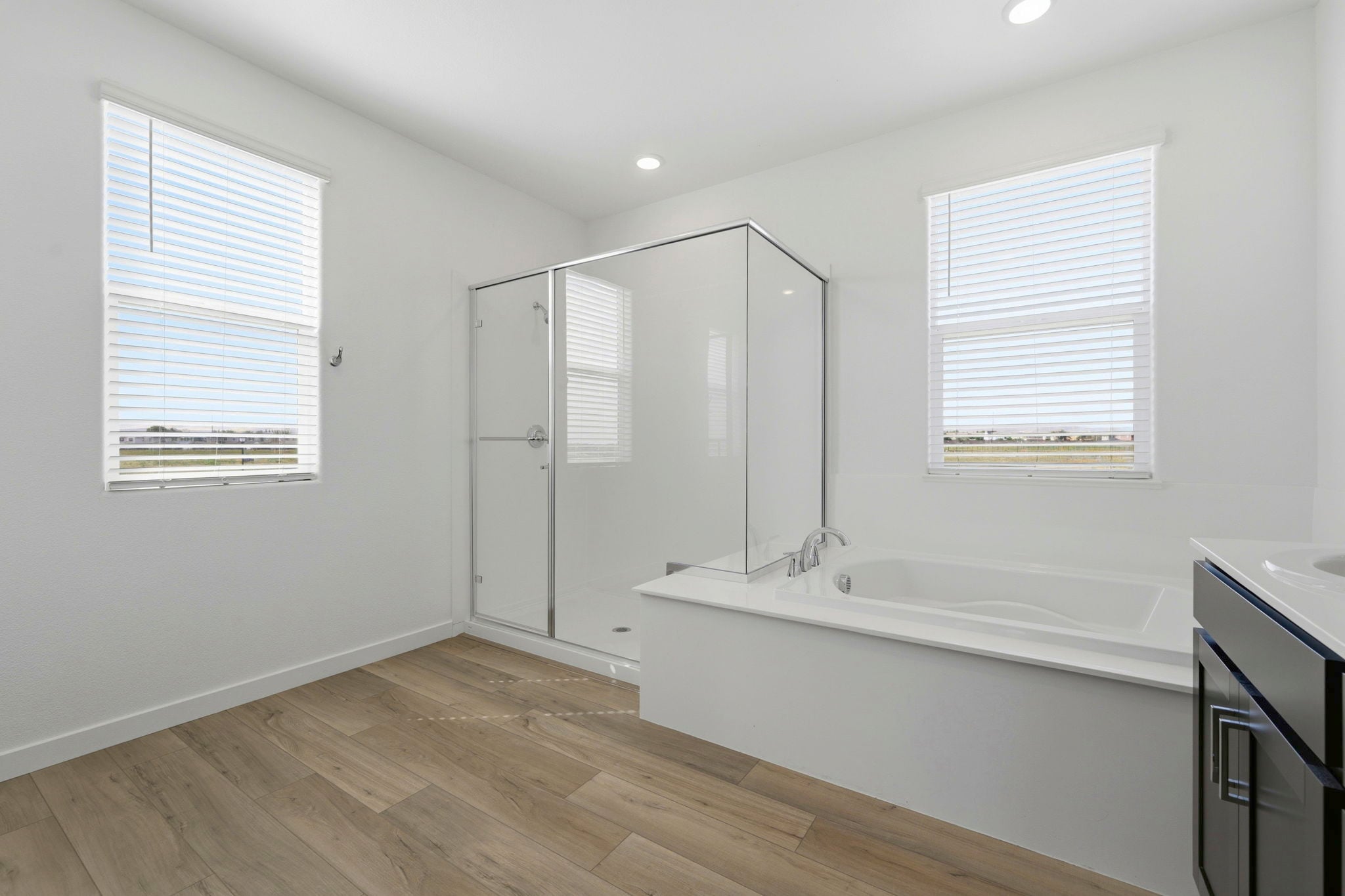 A bathroom with a tub and sink.