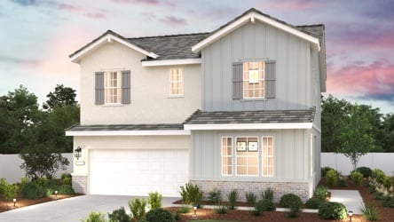 A white house with a driveway.