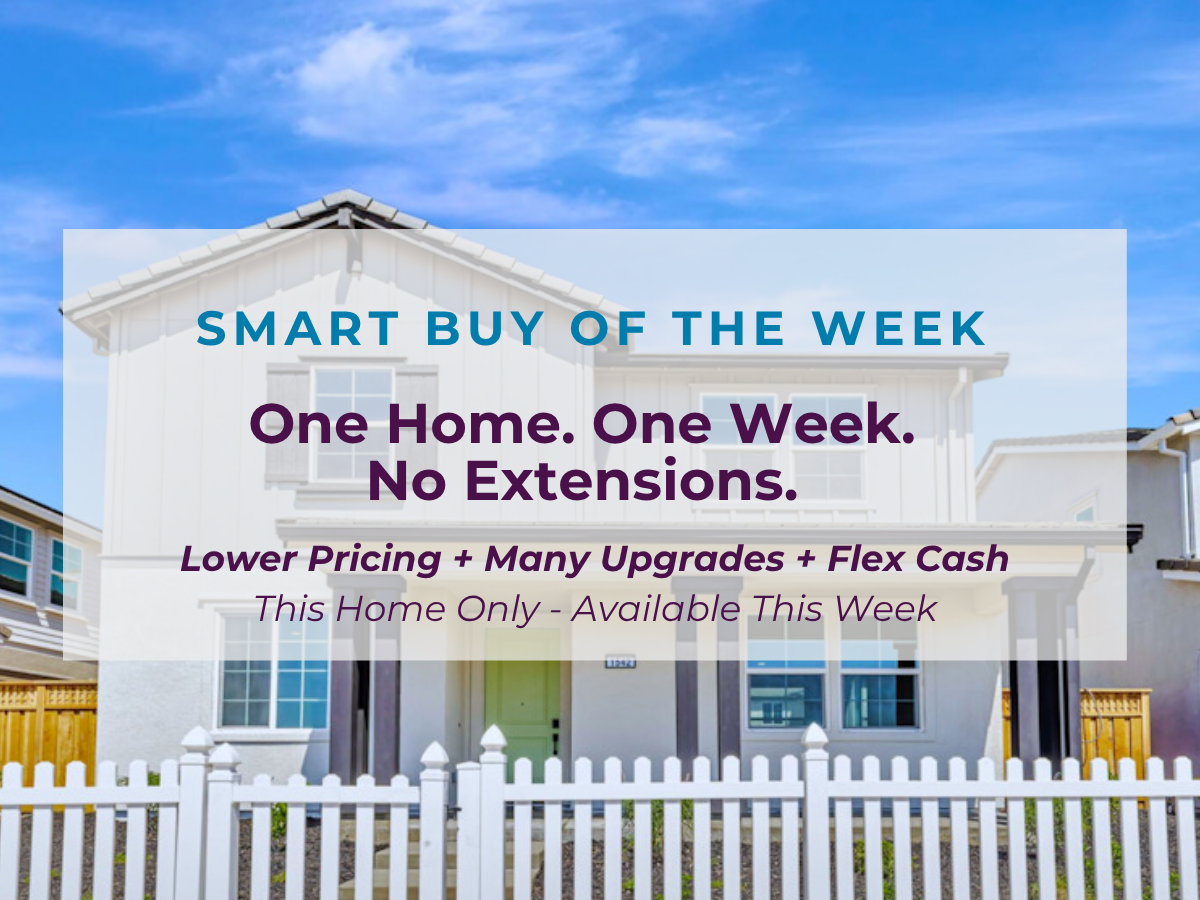 A white building with a white fence.