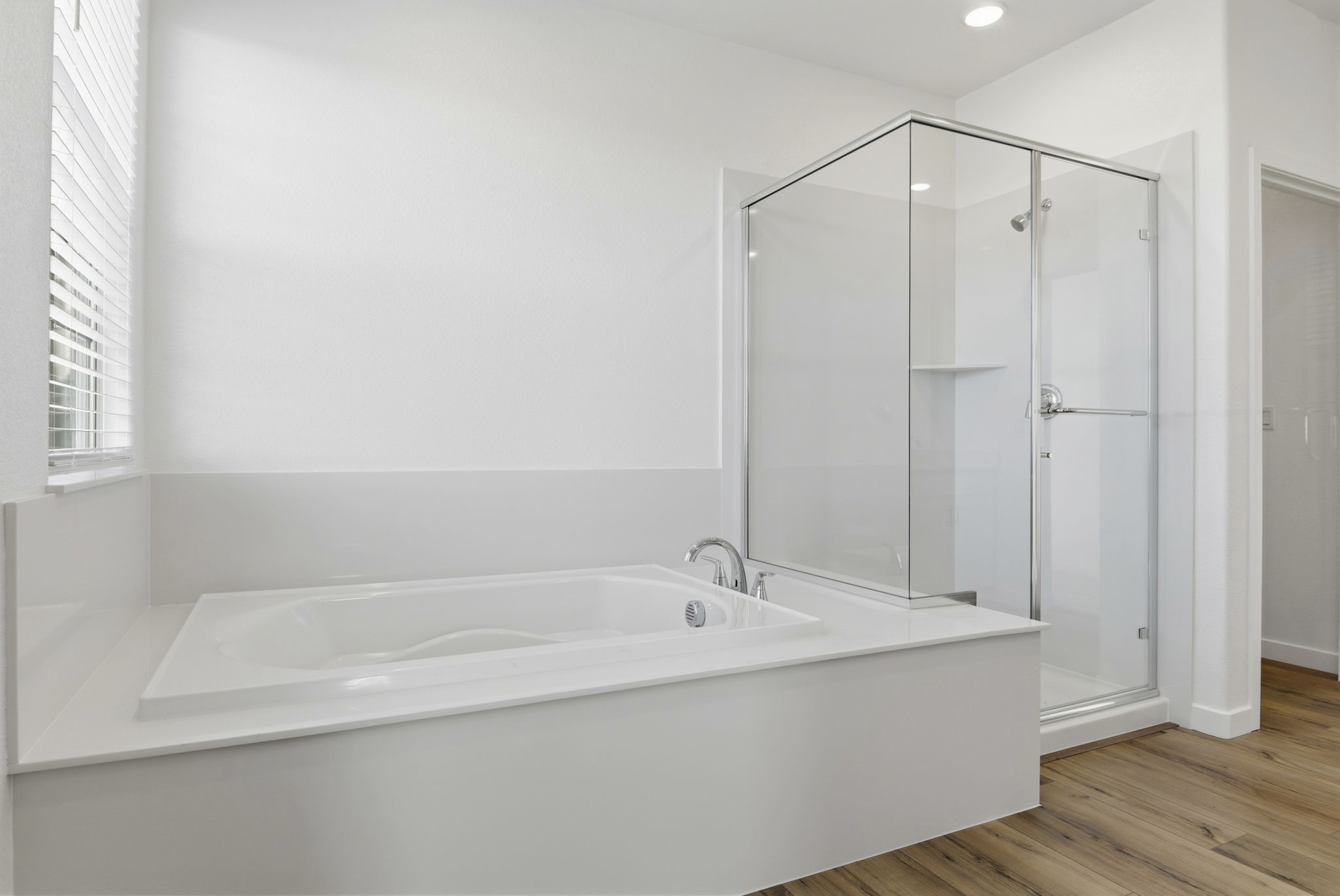 A bathroom with a glass shower.