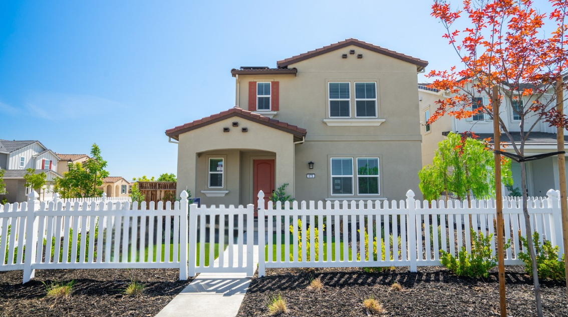 A house with a white picket fence.