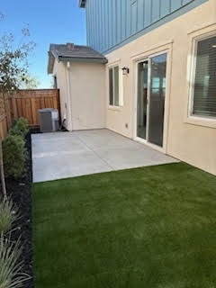 A house with a green lawn.