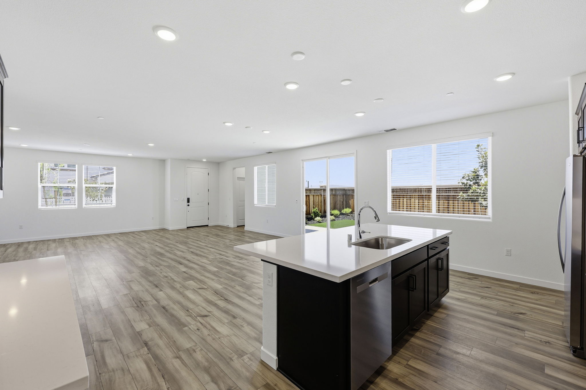 A kitchen with a wood floor.