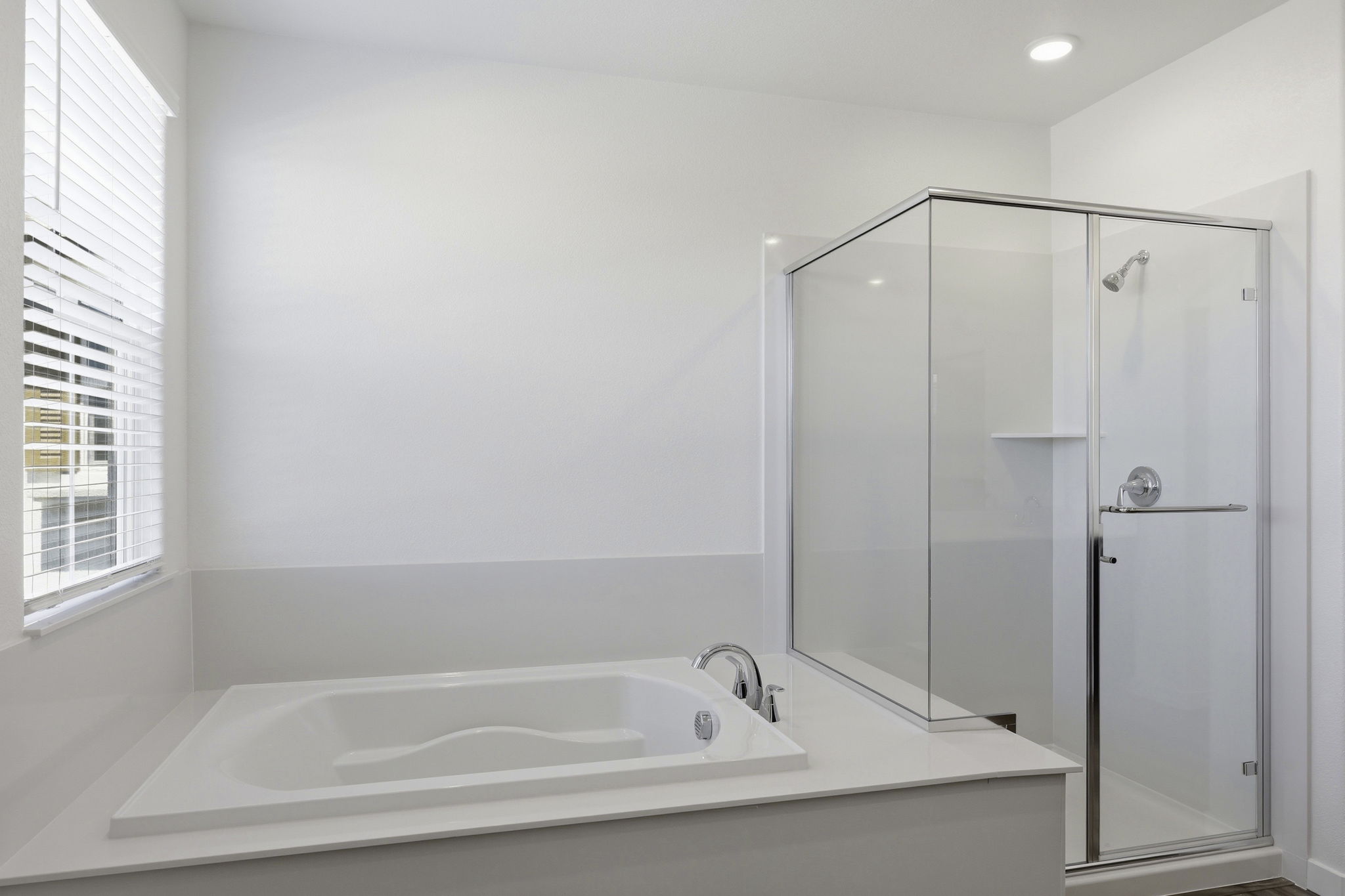 A bathroom with a glass shower.